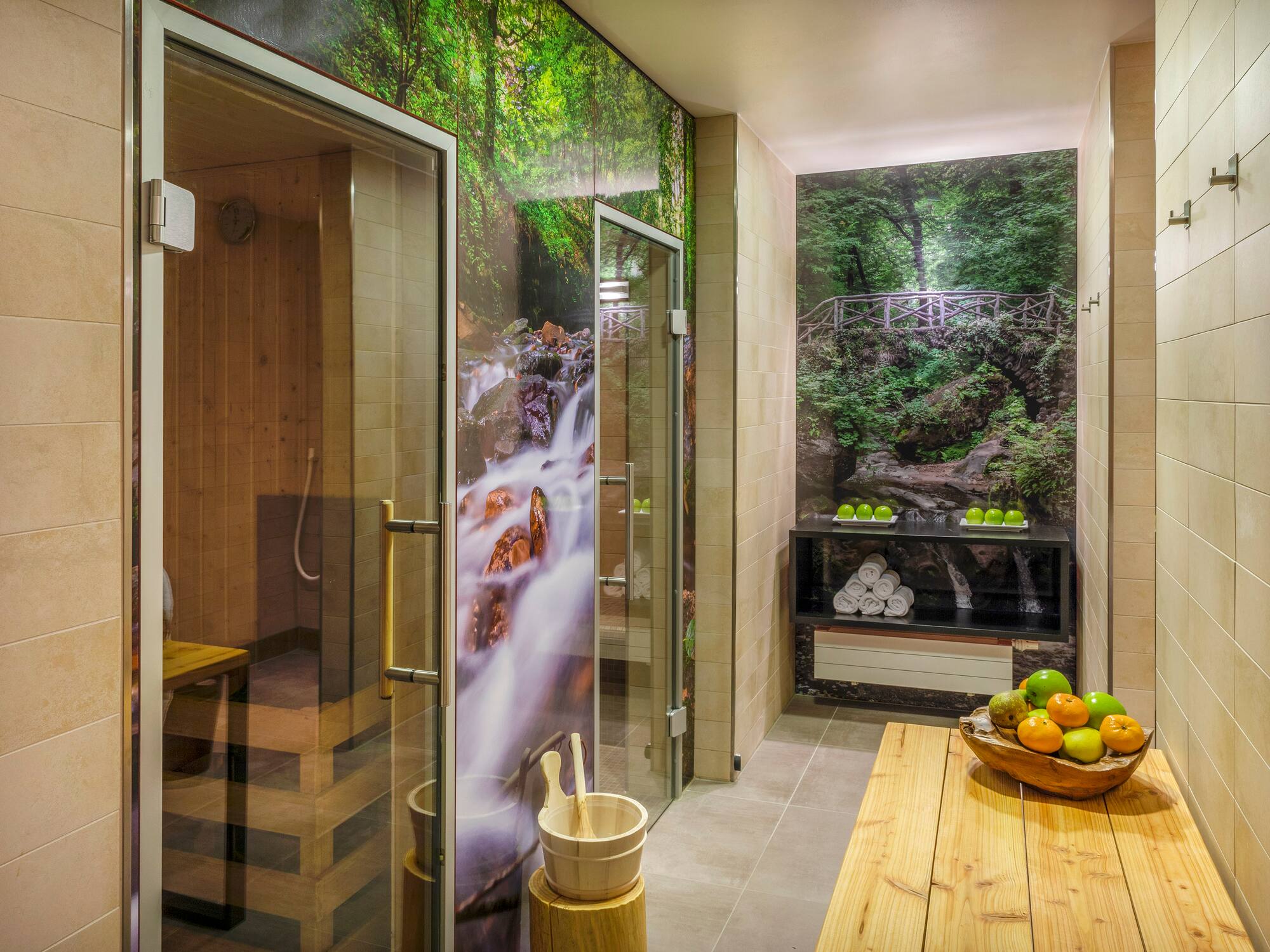 a room with a glass shower and a wooden bench