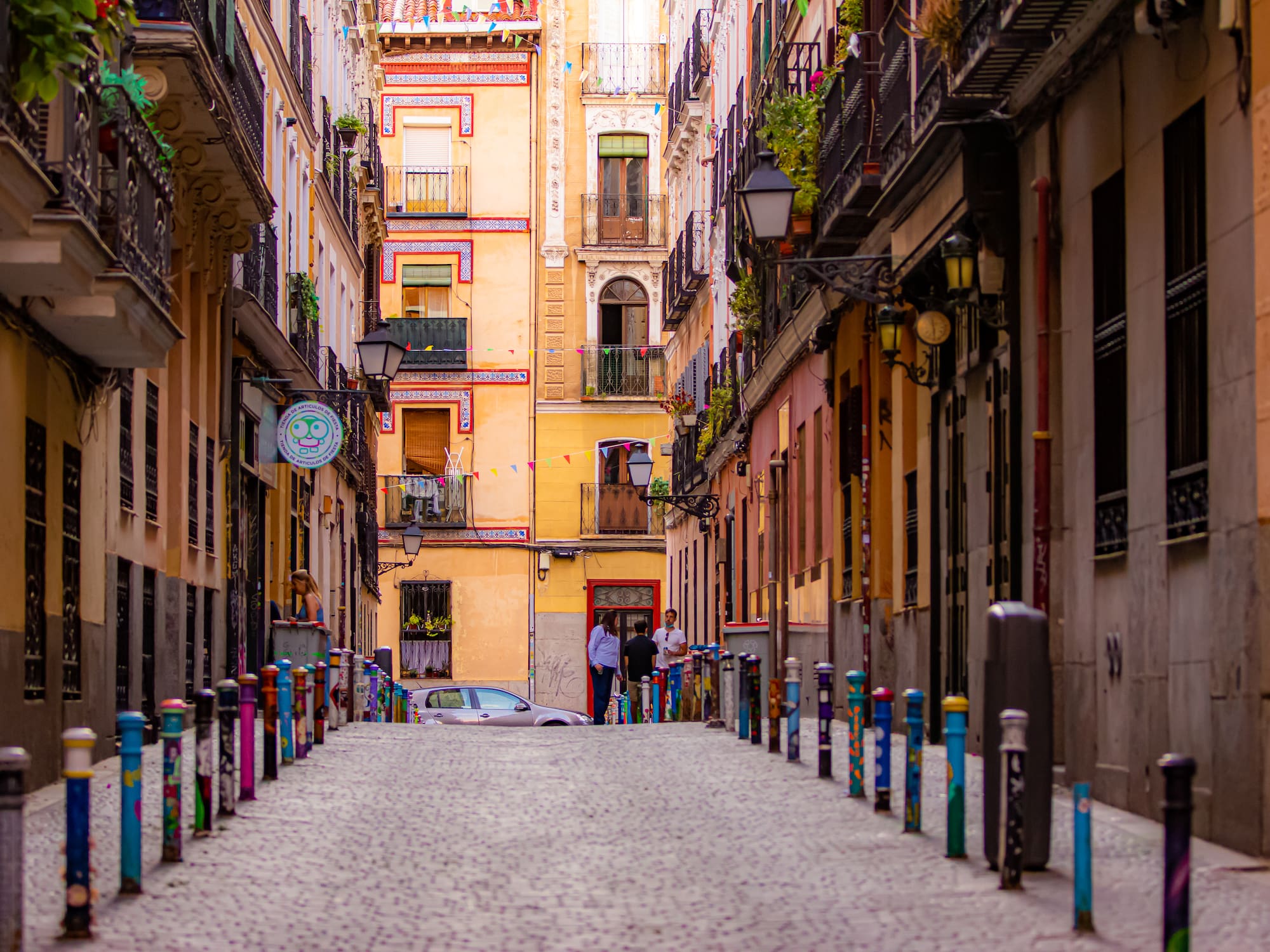 a street with buildings and cars