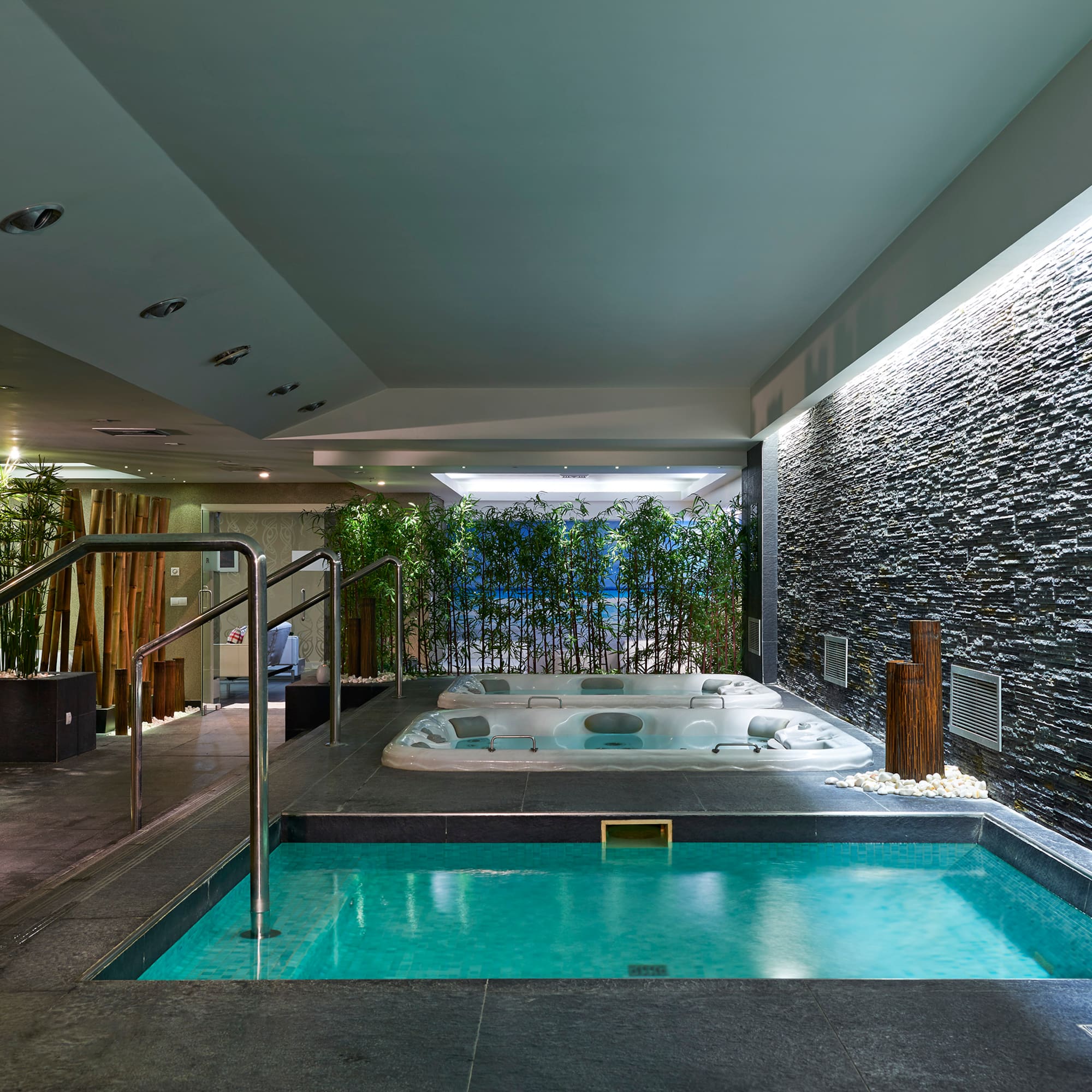 a indoor jacuzzi with a hot tub.