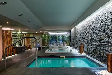 a indoor jacuzzi with a hot tub.
