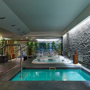 a indoor jacuzzi with a hot tub.
