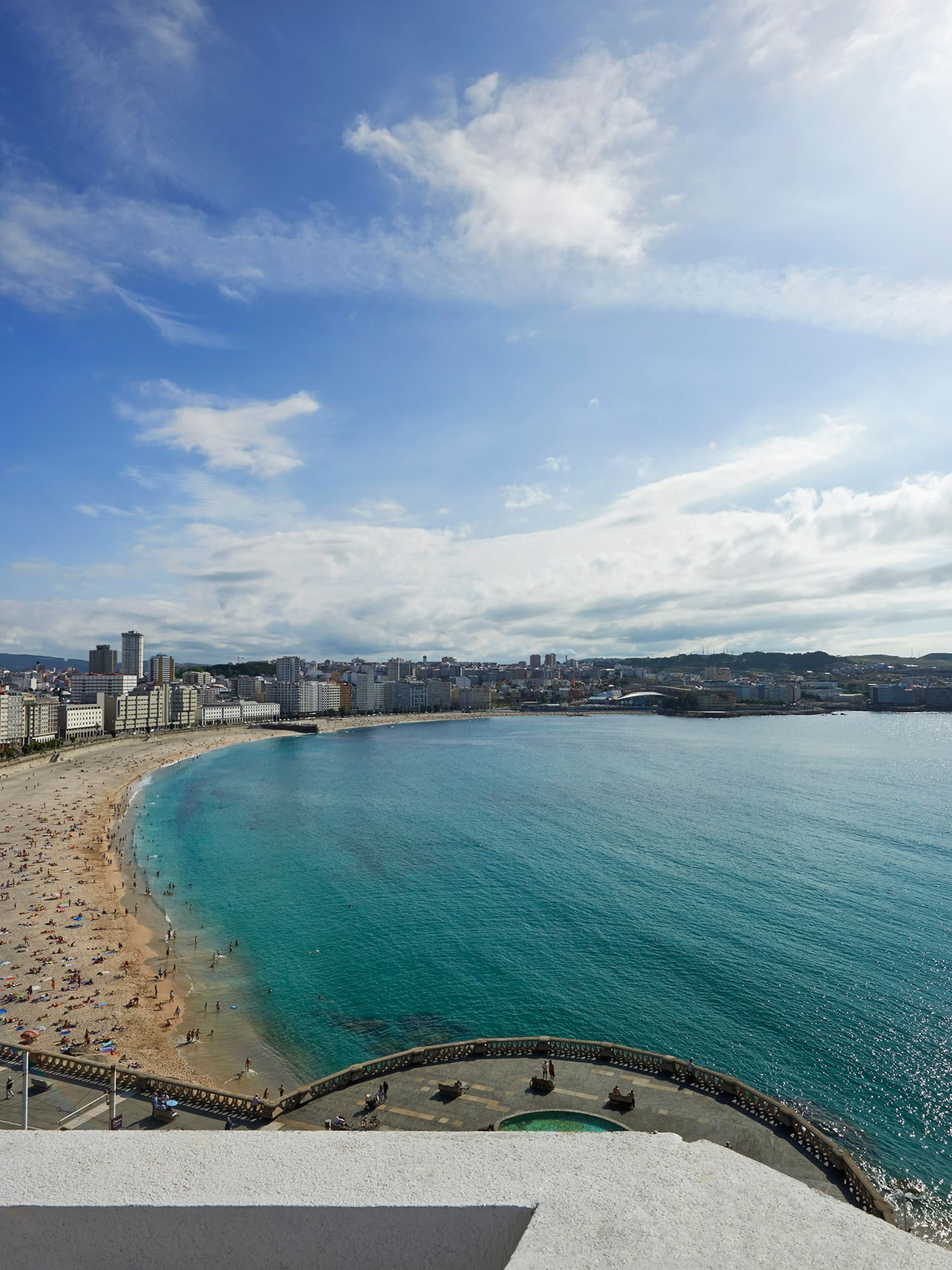 a beach with buildings and water