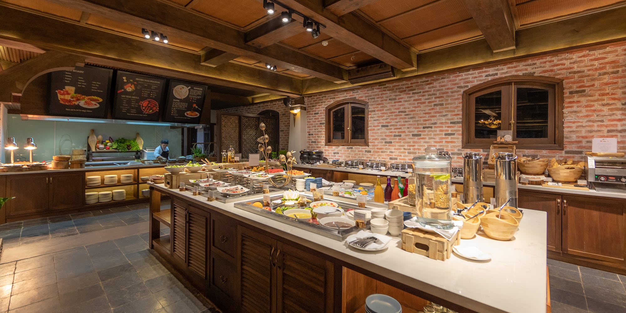 a large kitchen with food on the counter