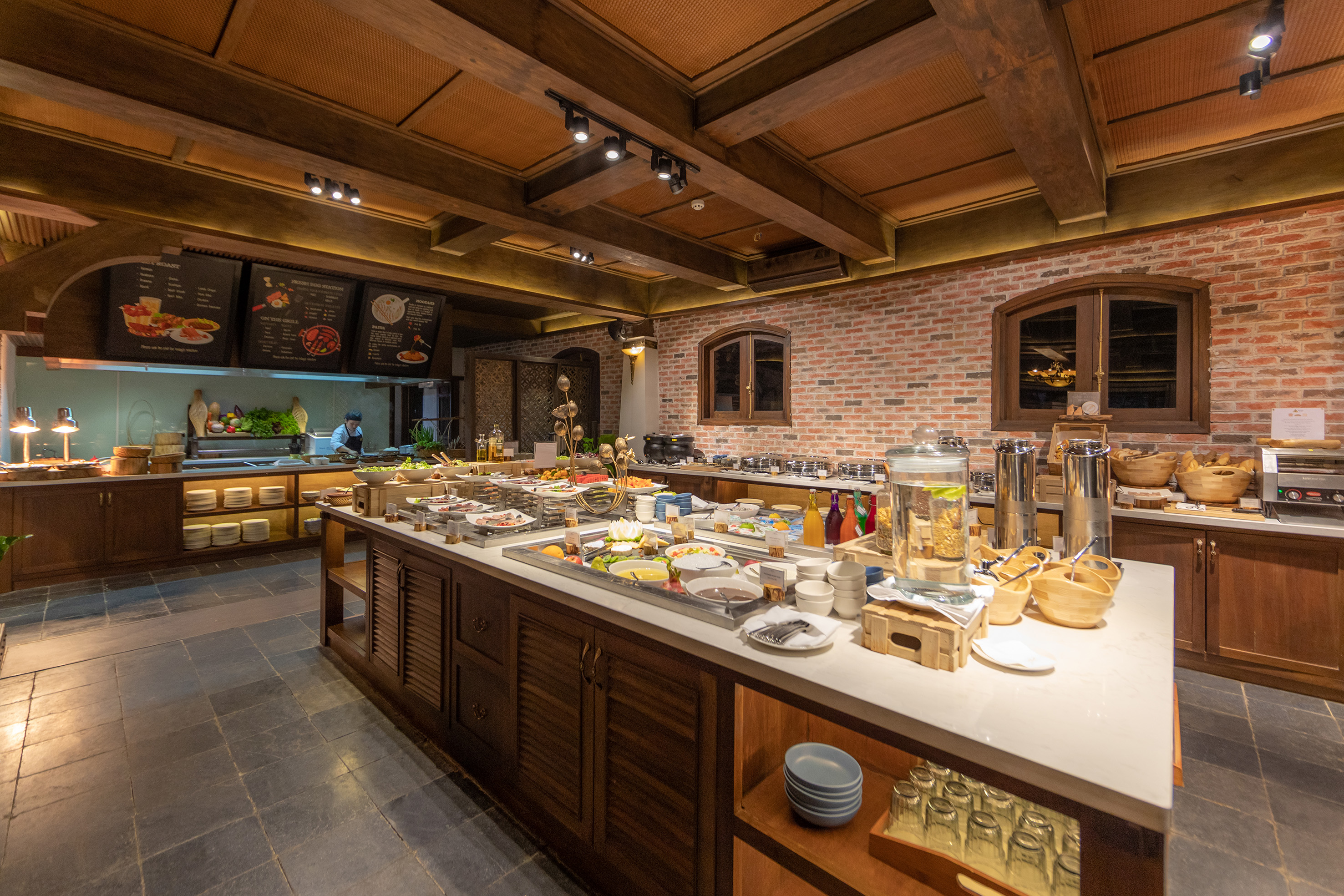 a large kitchen with food on the counter