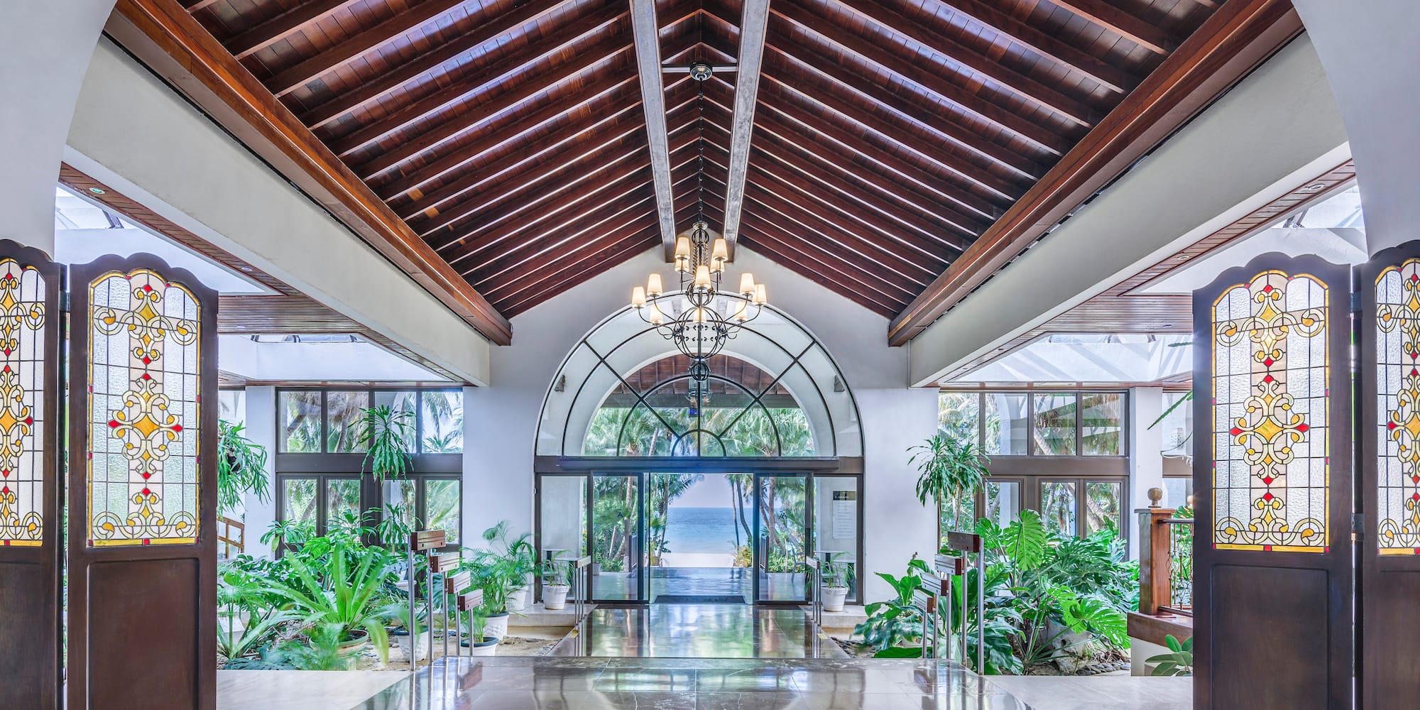 a large building with a glass ceiling and a chandelier