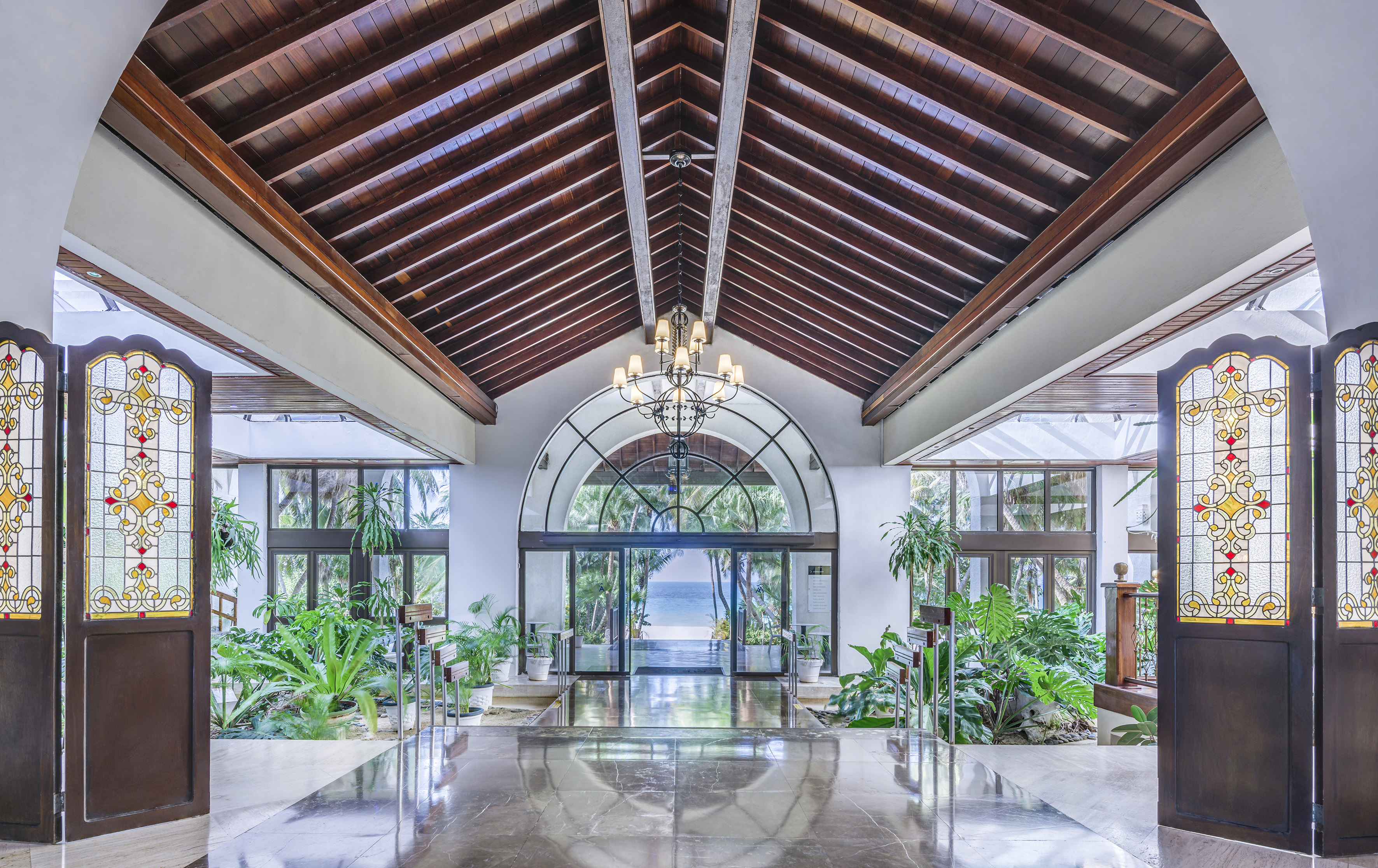 a large building with a glass ceiling and a chandelier