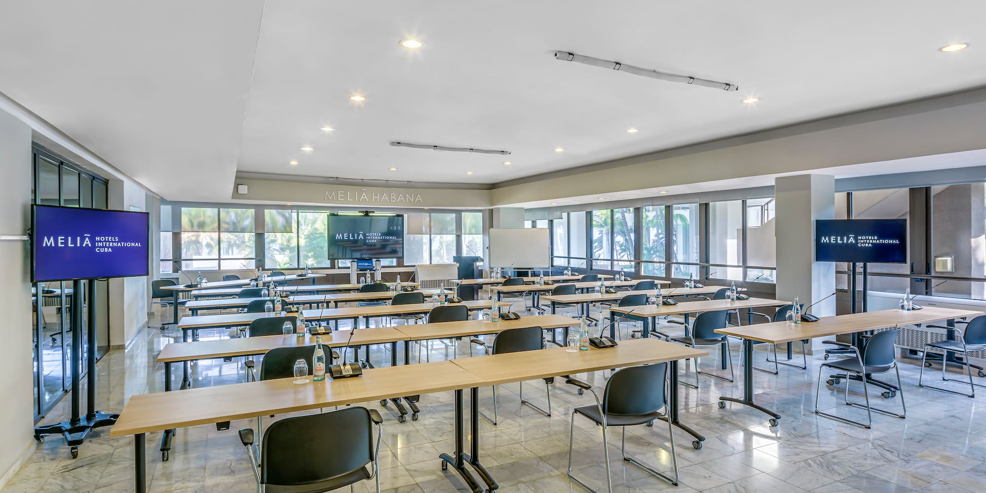 a room with tables and chairs