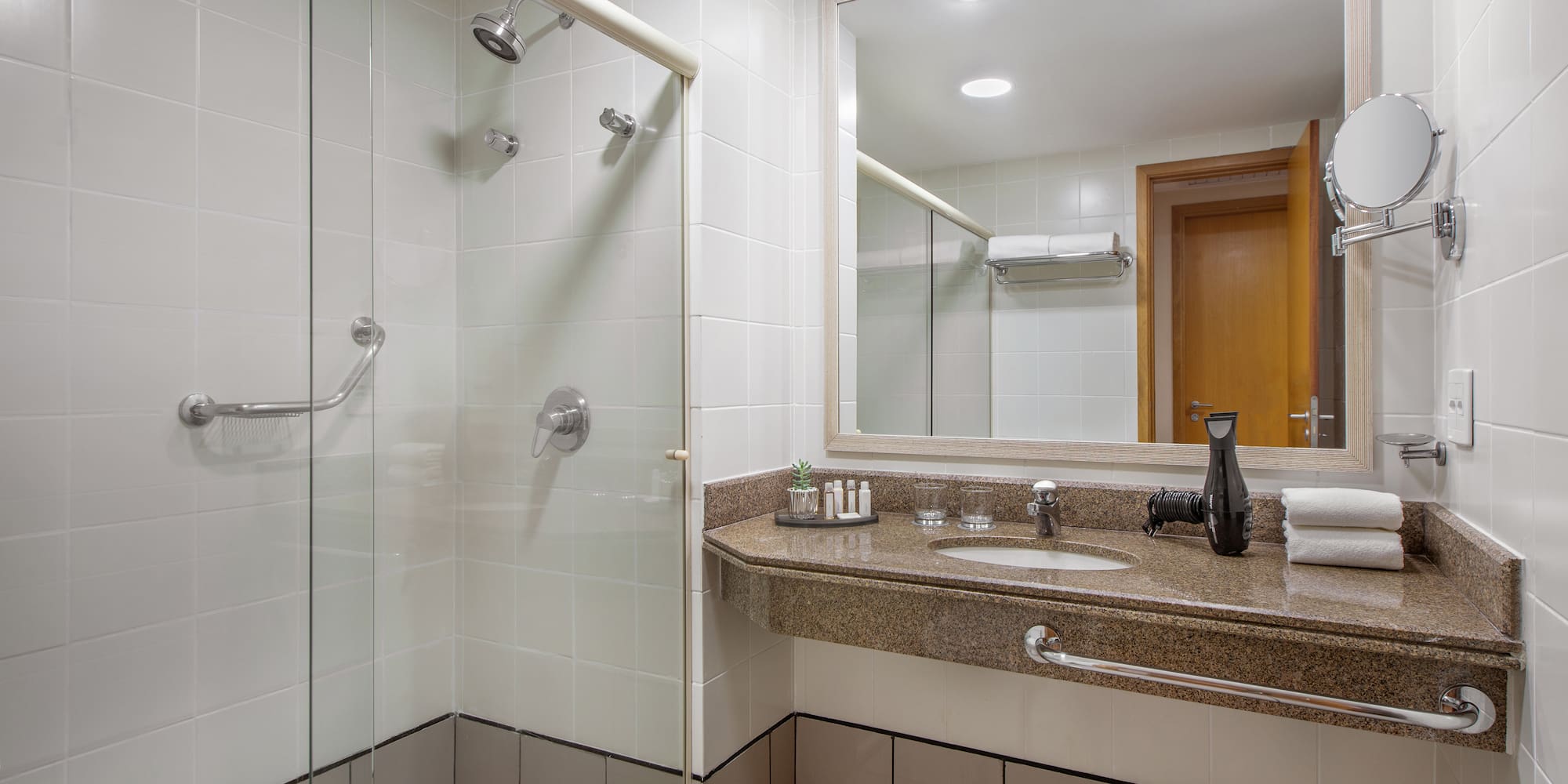 a bathroom with a shower and sink