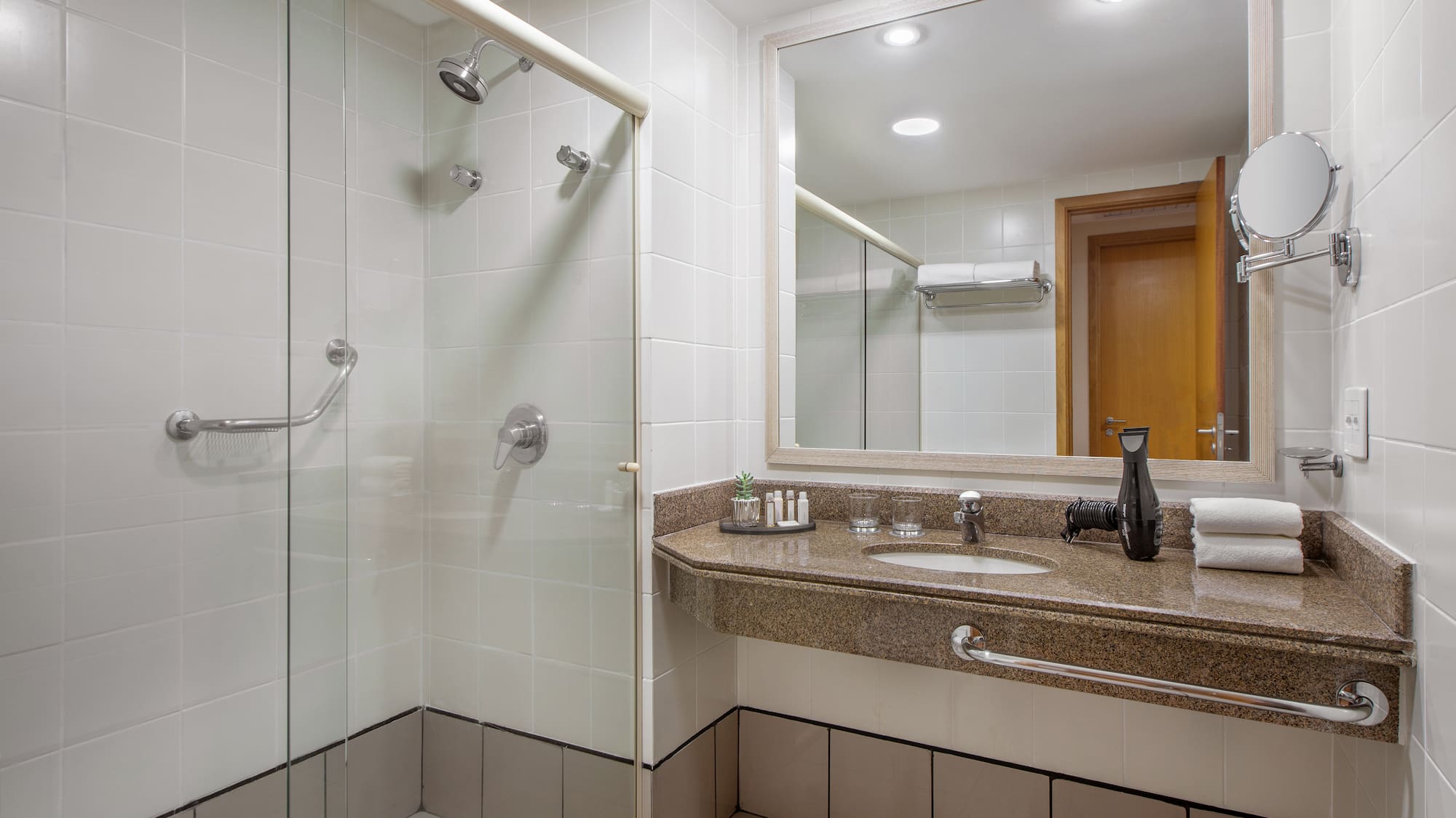 a bathroom with a shower and sink