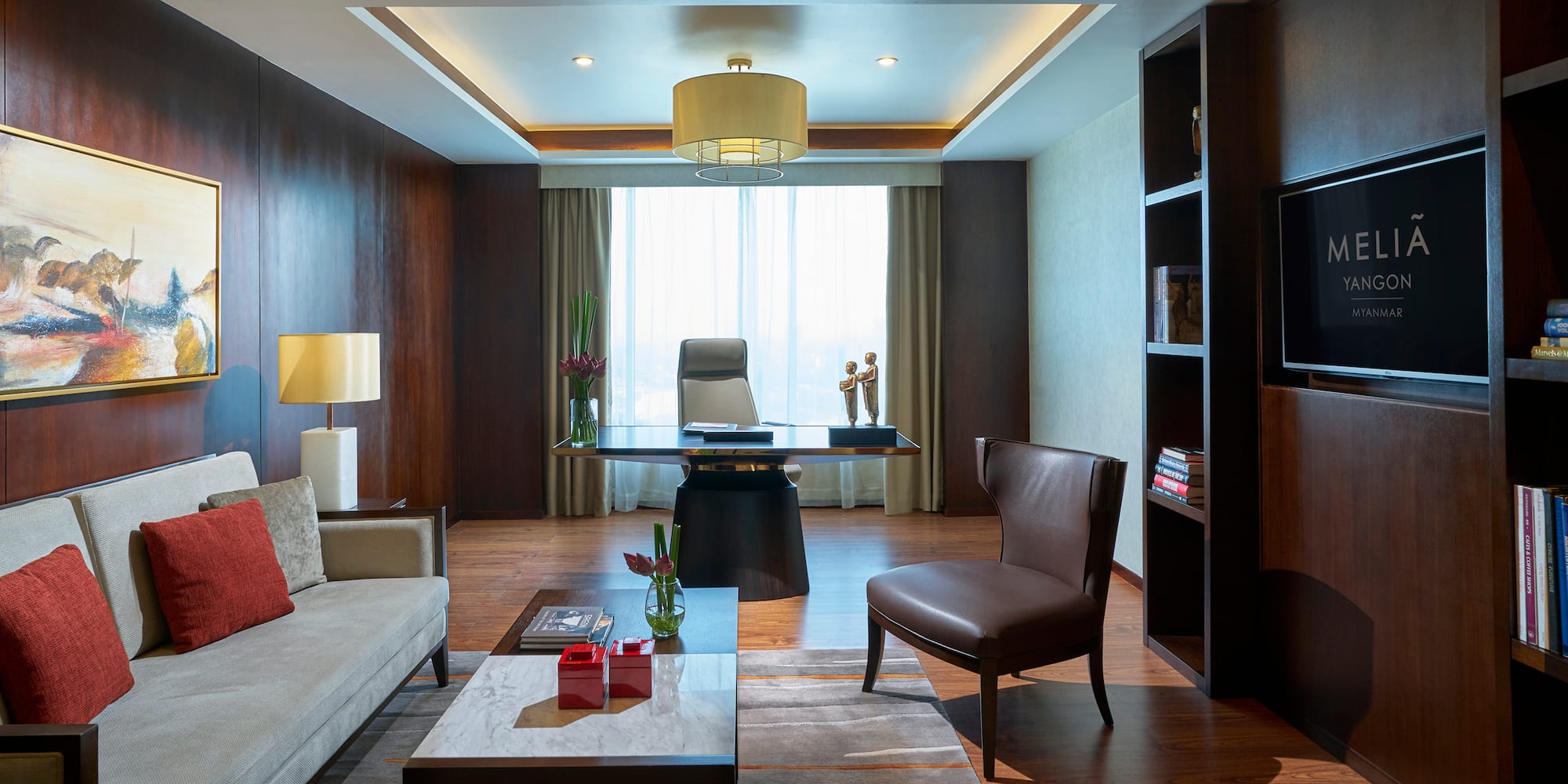 a room with a desk and couch