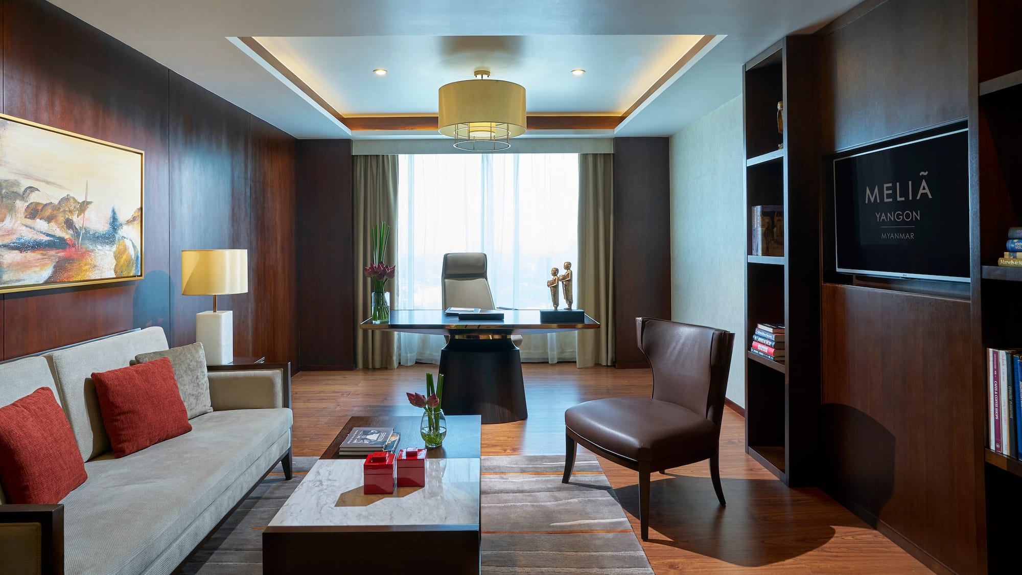 a room with a desk and couch