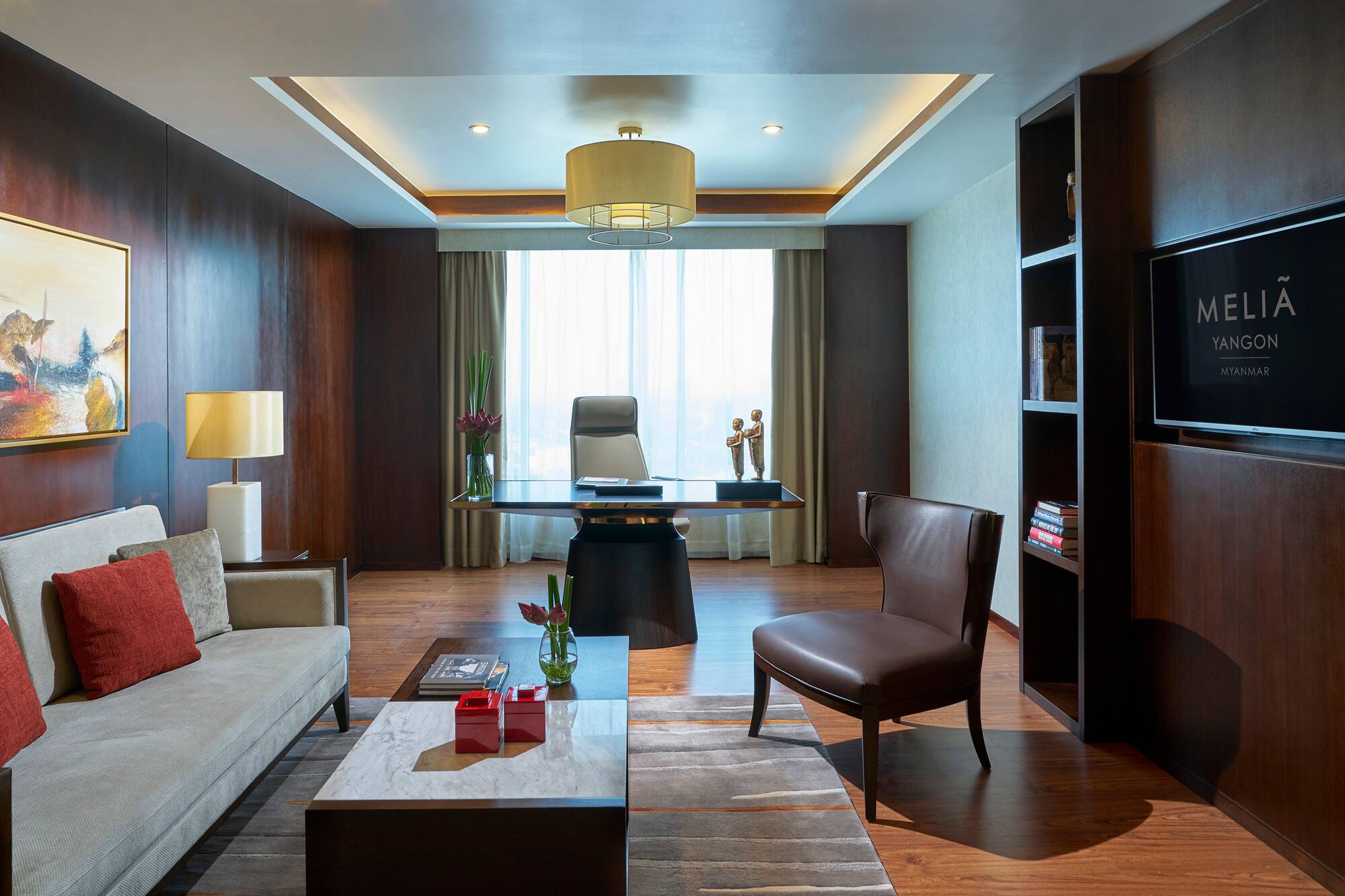 a room with a desk and couch