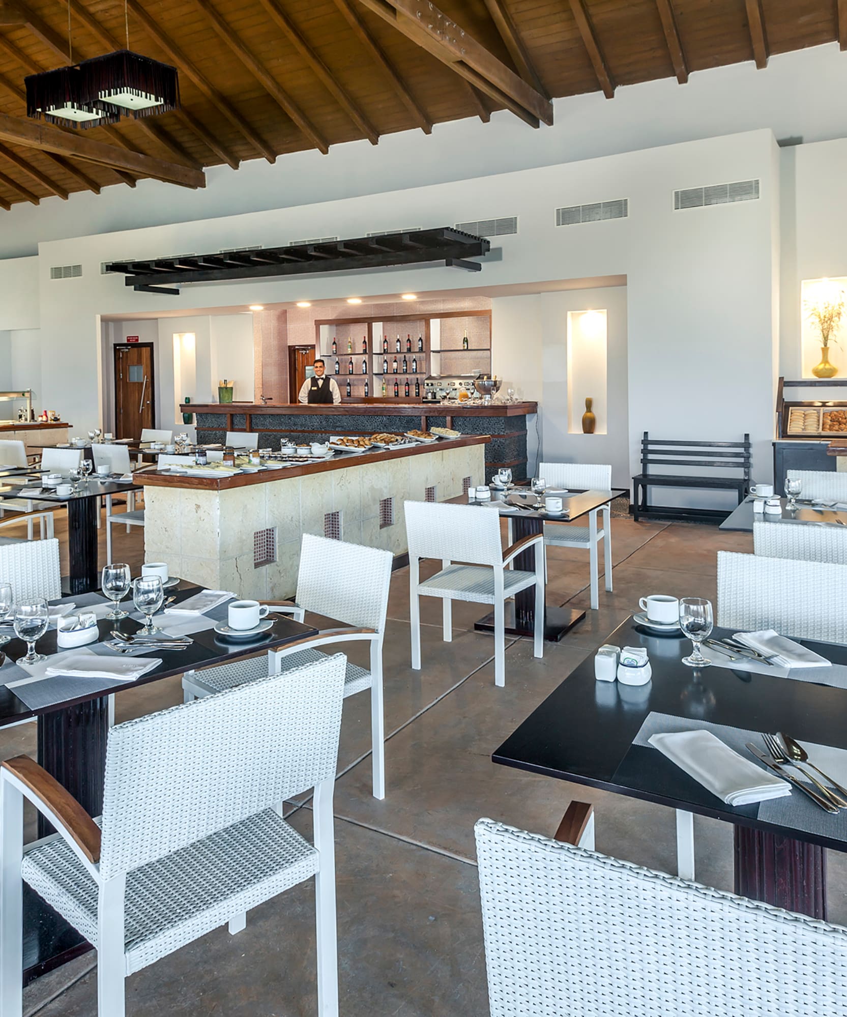 a restaurant with tables and chairs