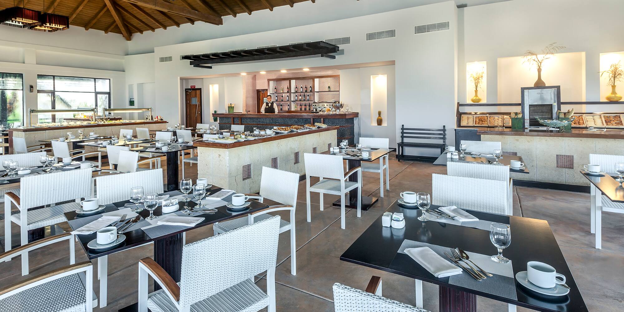 a restaurant with tables and chairs