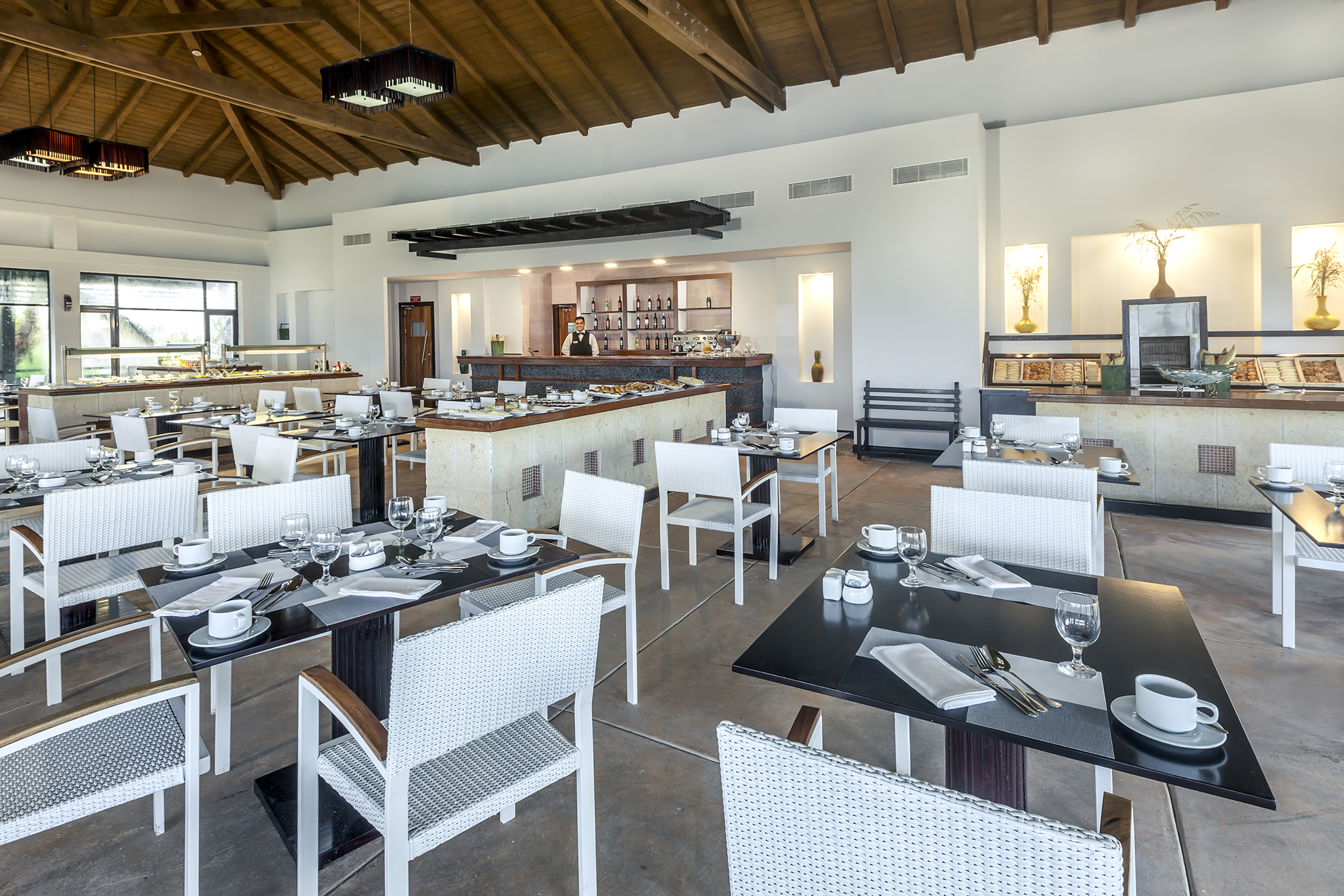 a restaurant with tables and chairs