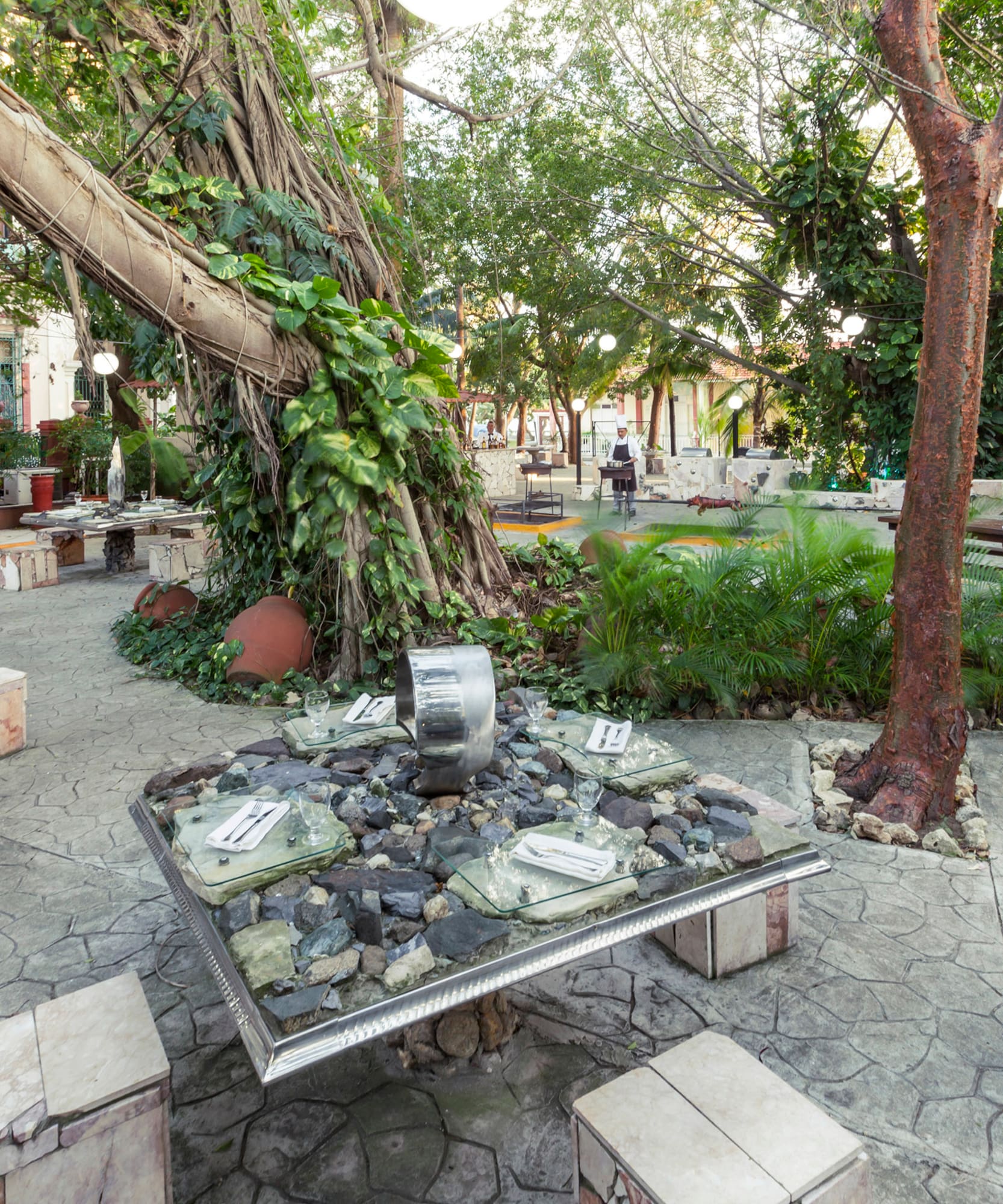 a table with rocks and a tree in the middle