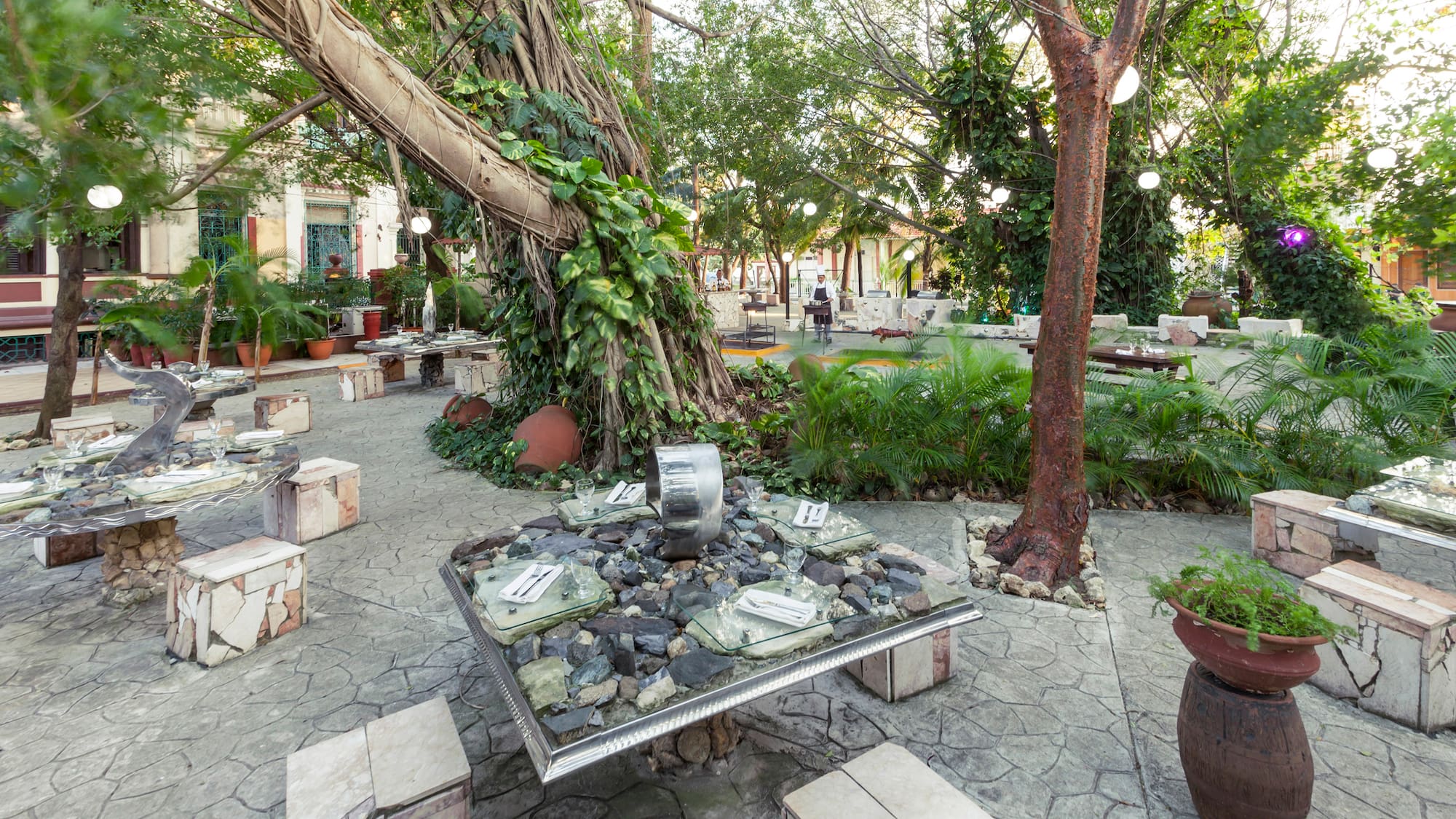 a table with rocks and a tree in the middle