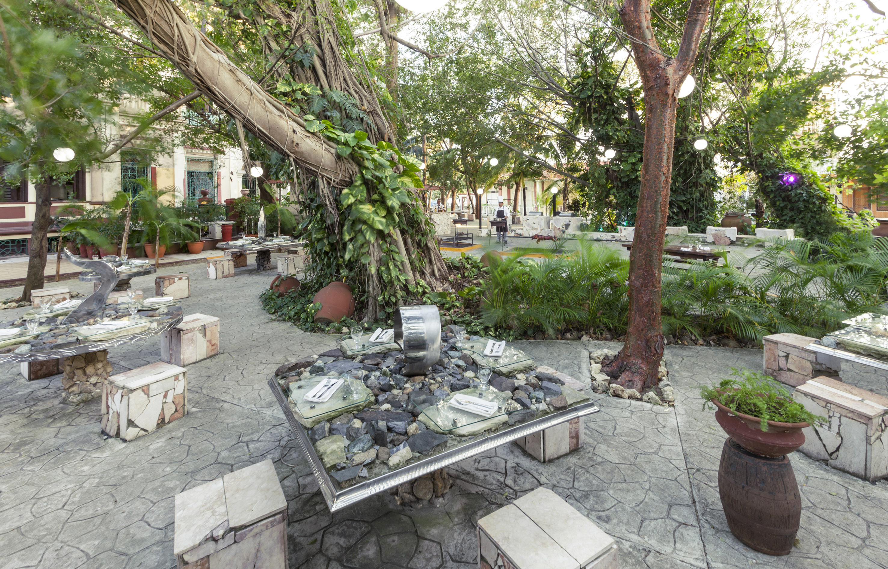 a table with rocks and a tree in the middle