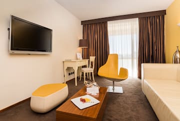 a room with a television and a chair