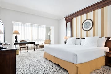 a room with a bed and a desk