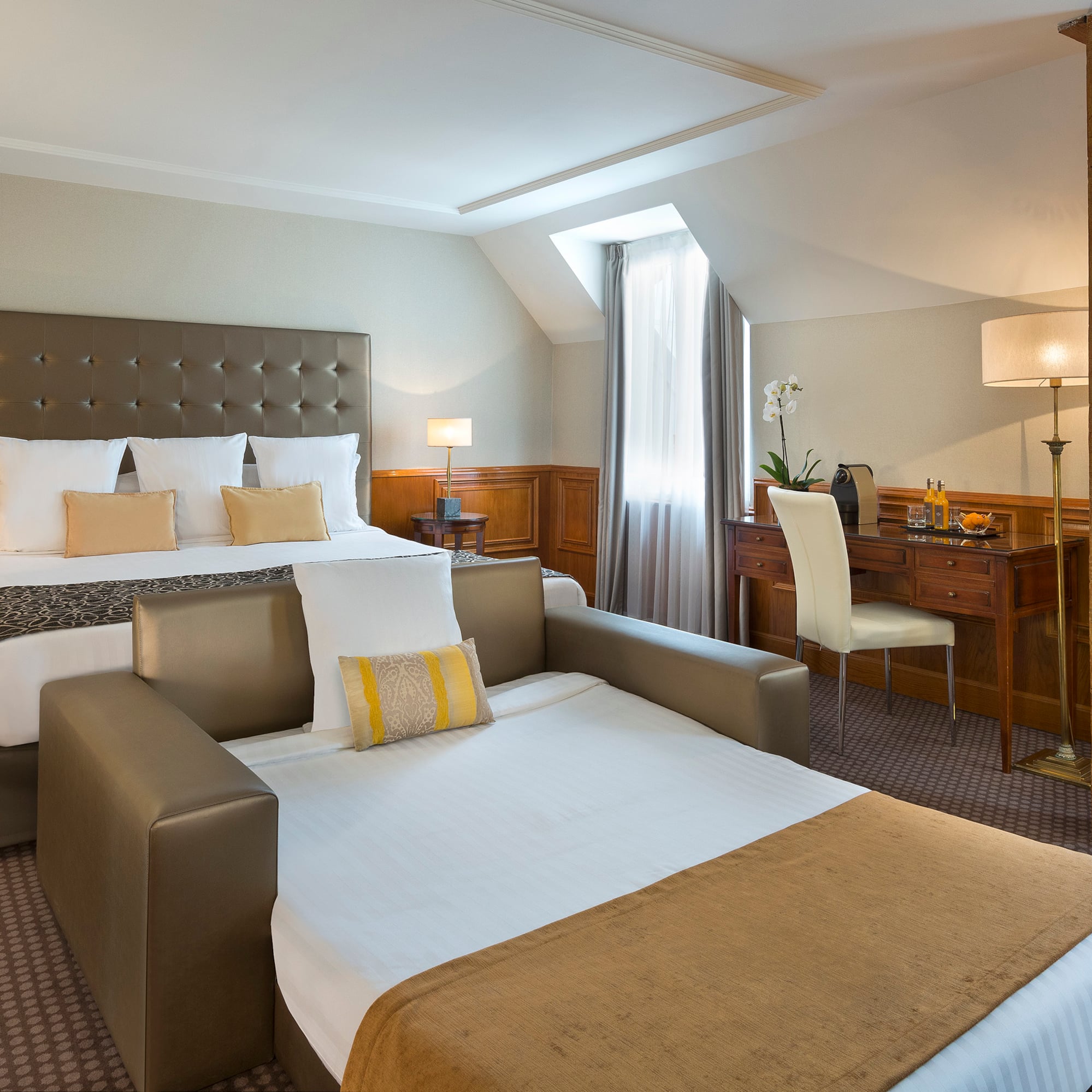 a room with a bed and a desk