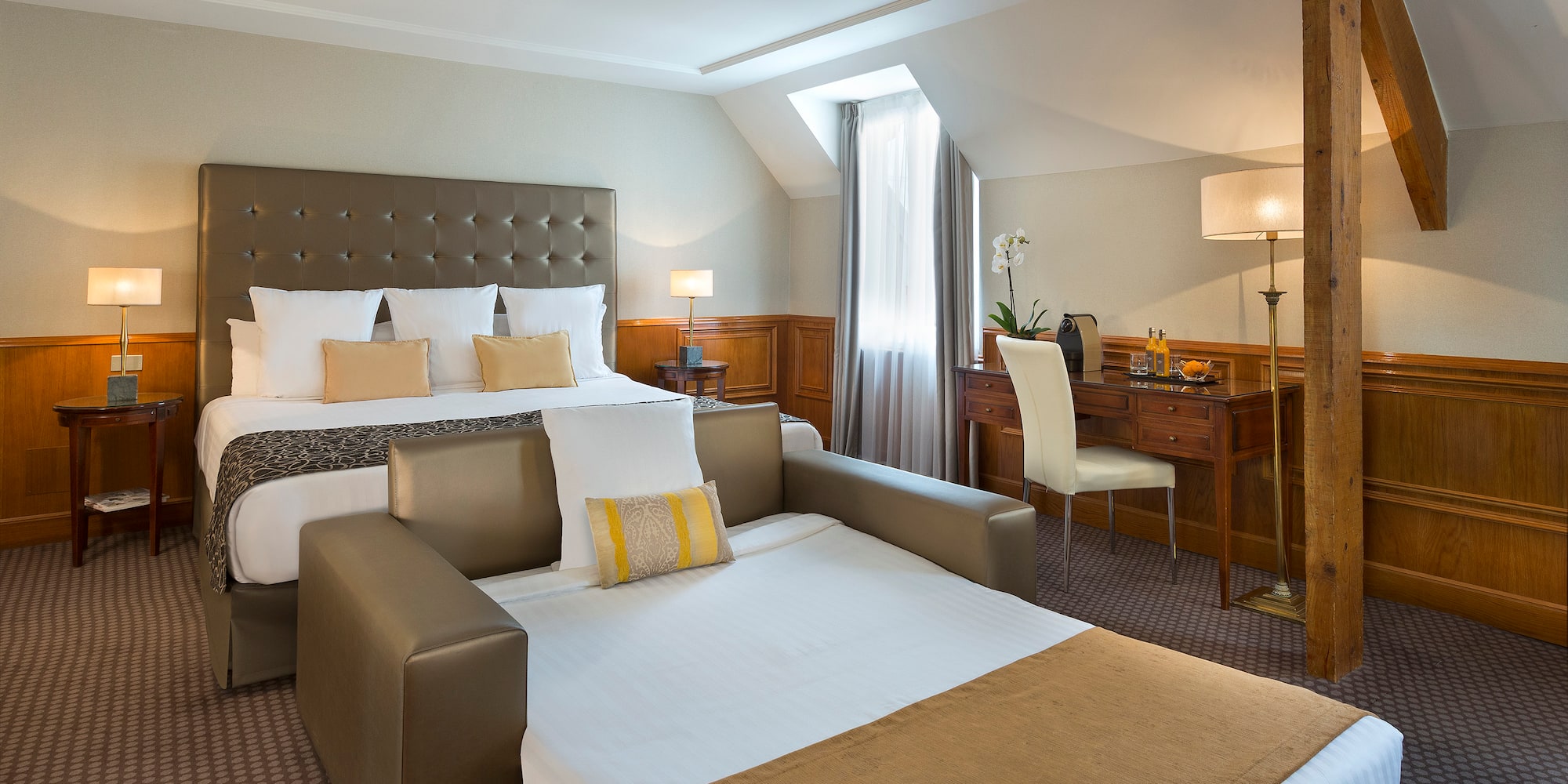 a room with a bed and a desk