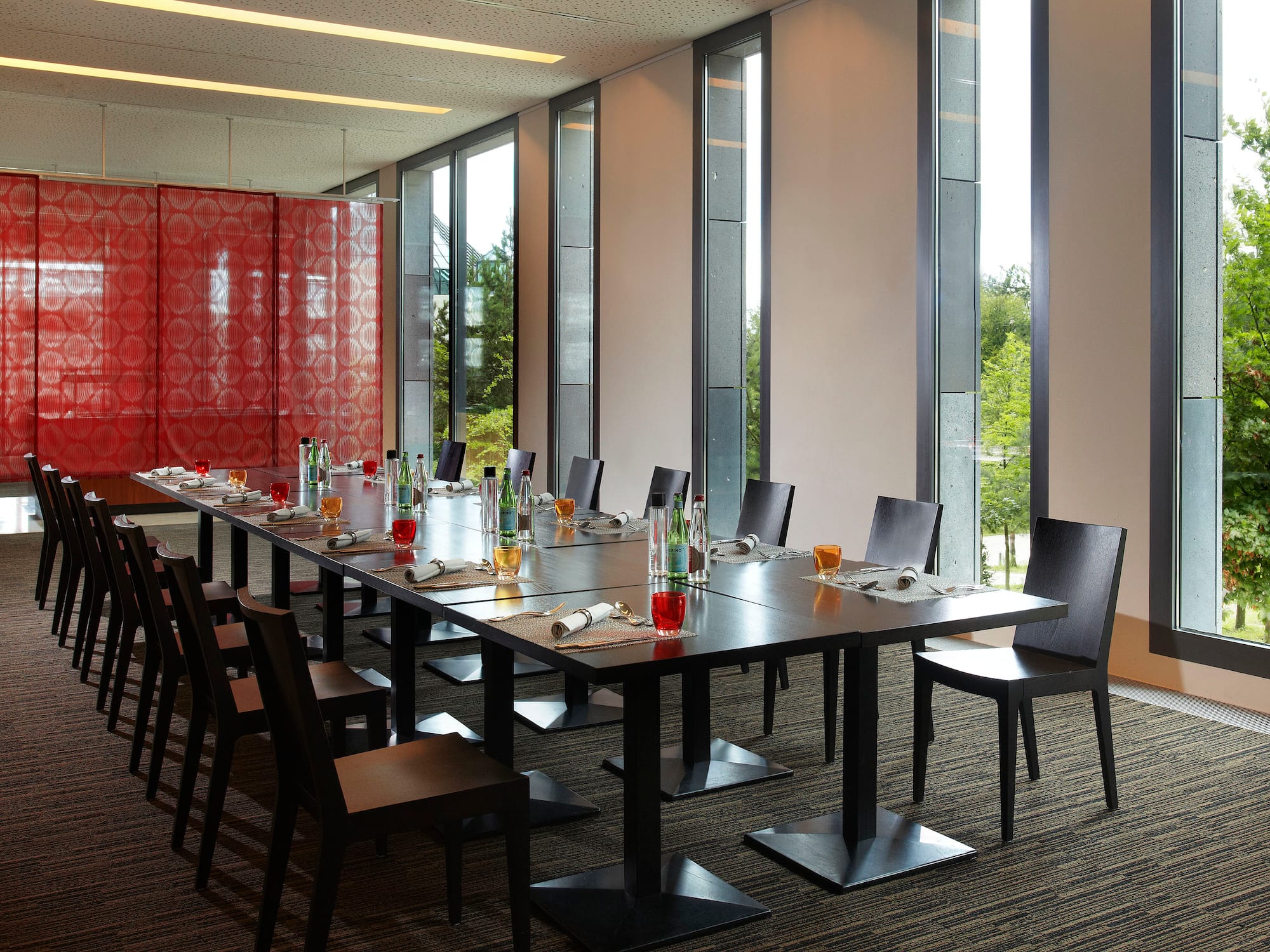 a long table with bottles and glasses on it