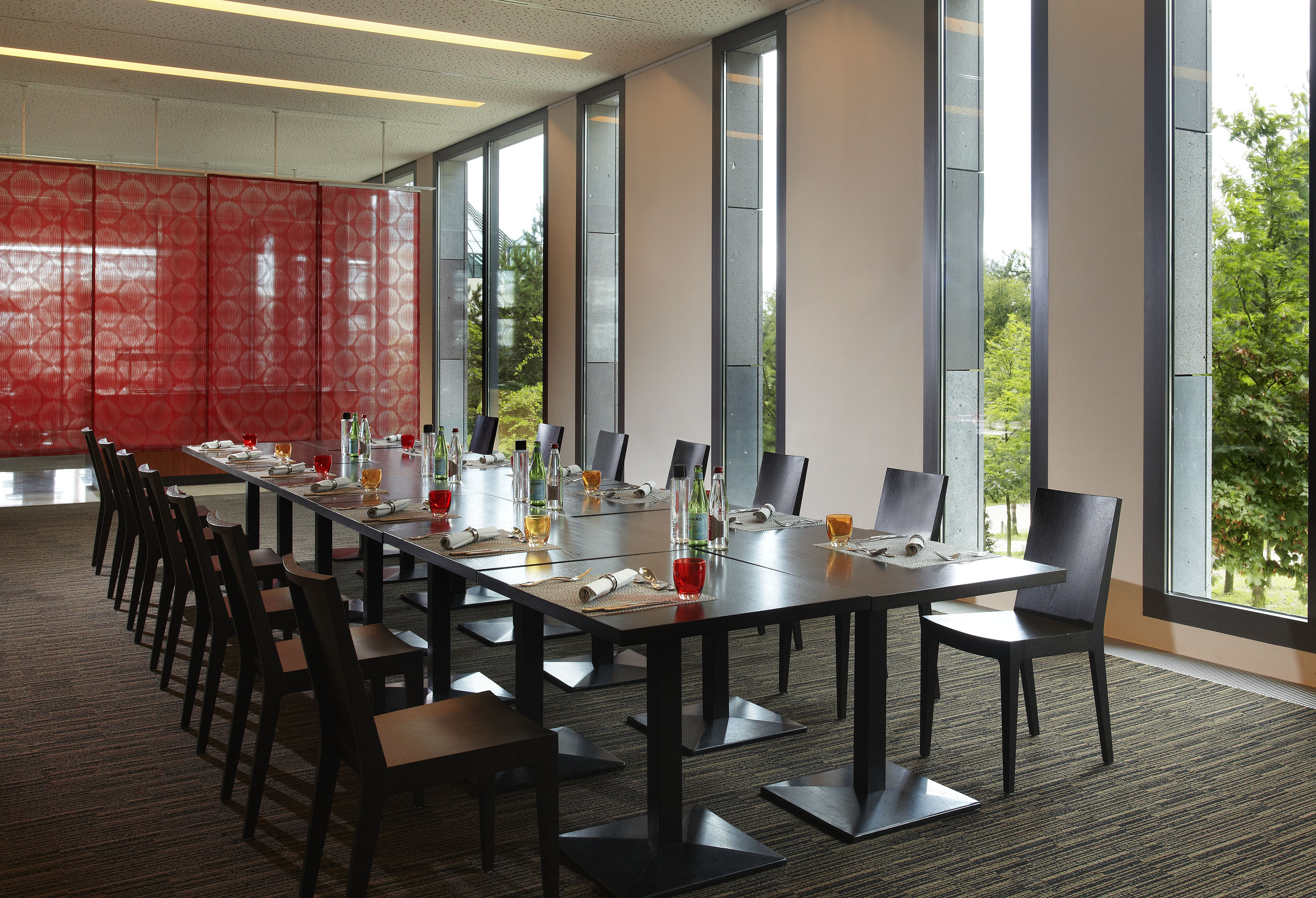 a long table with bottles and glasses on it
