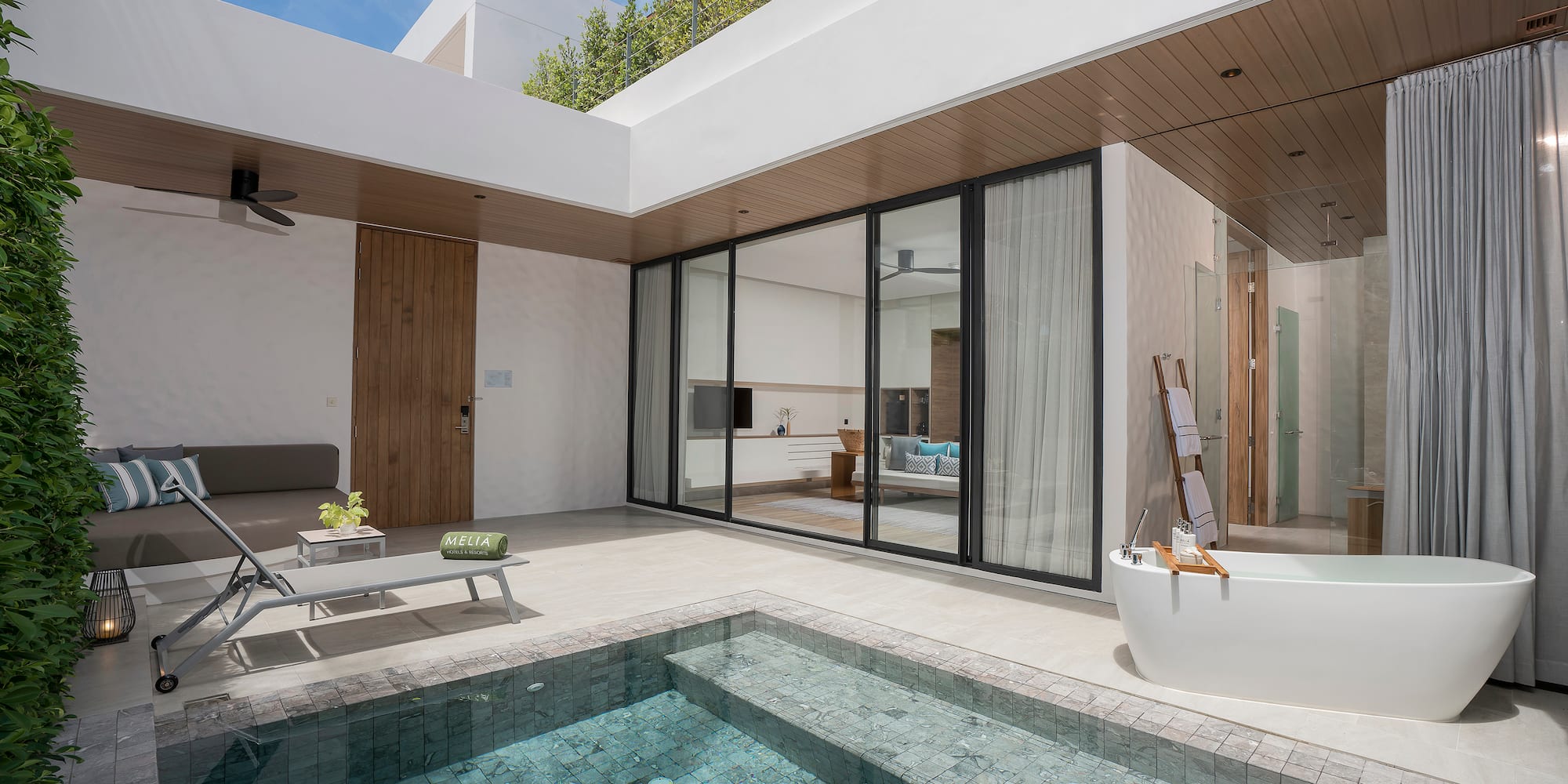 a swimming pool and a tub in a house