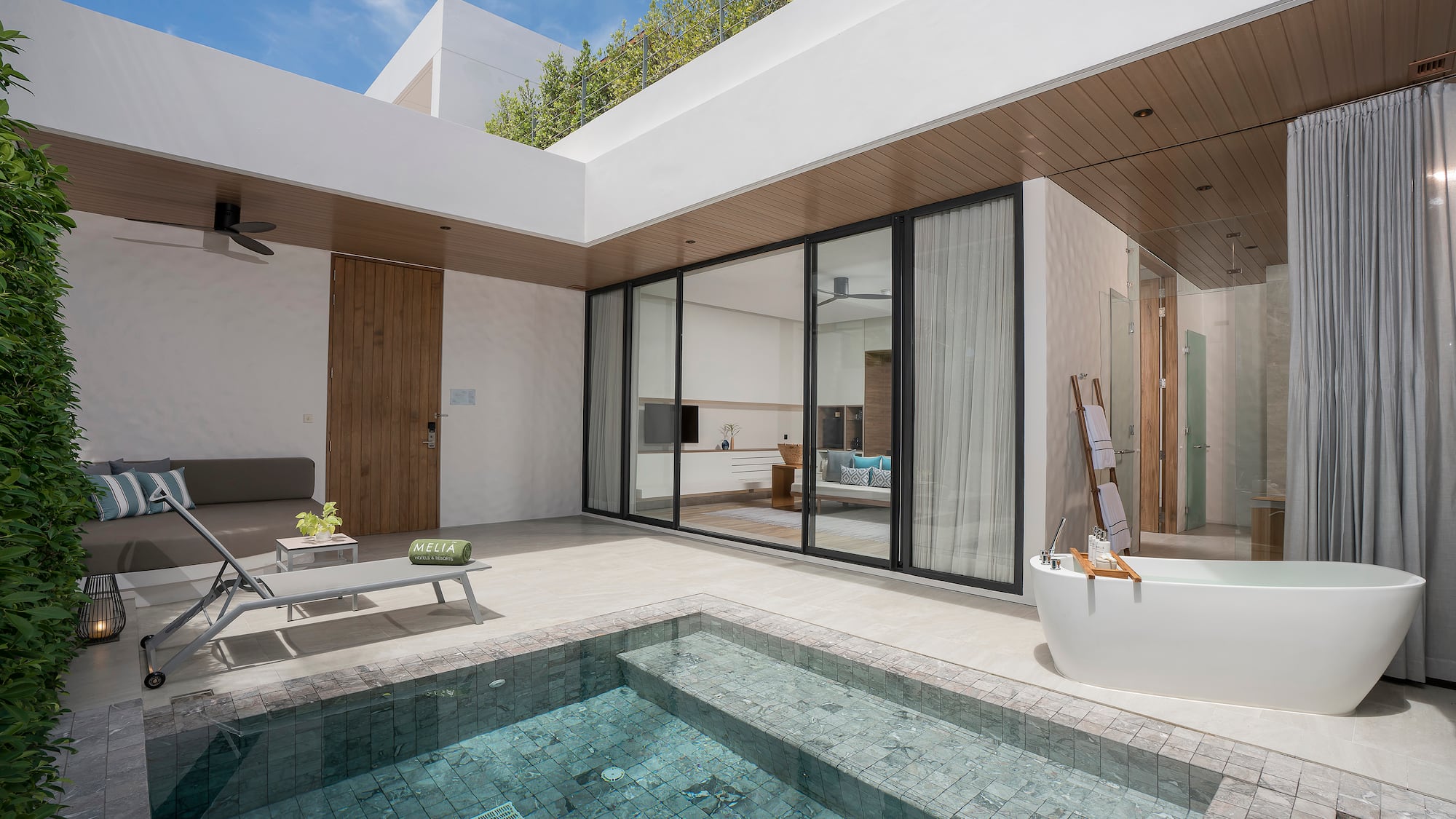 a swimming pool and a tub in a house