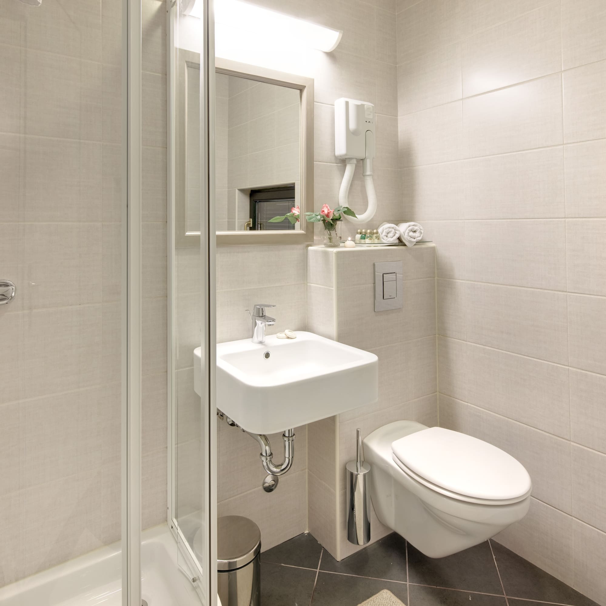 a bathroom with a shower and sink