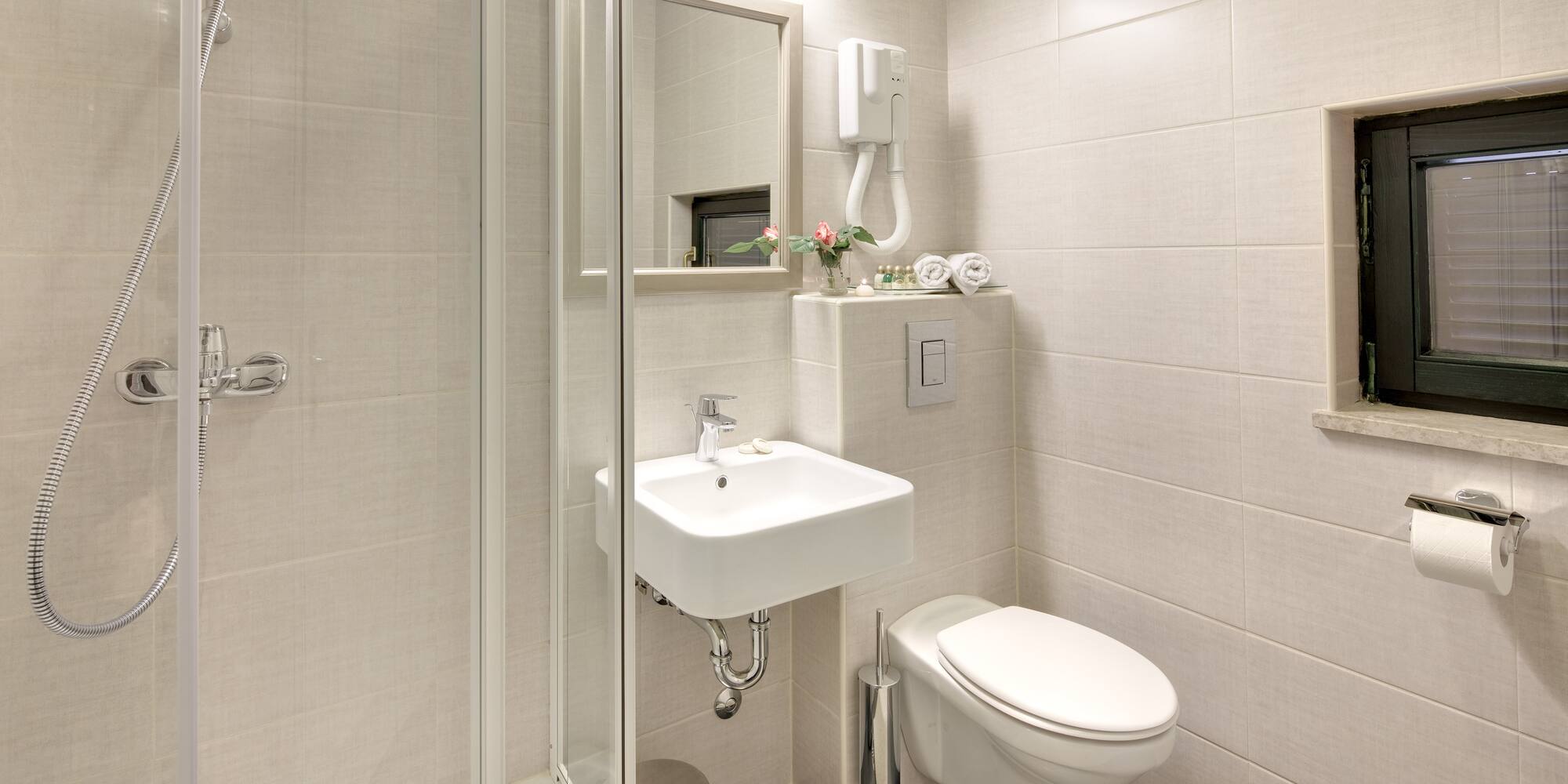 a bathroom with a shower and sink