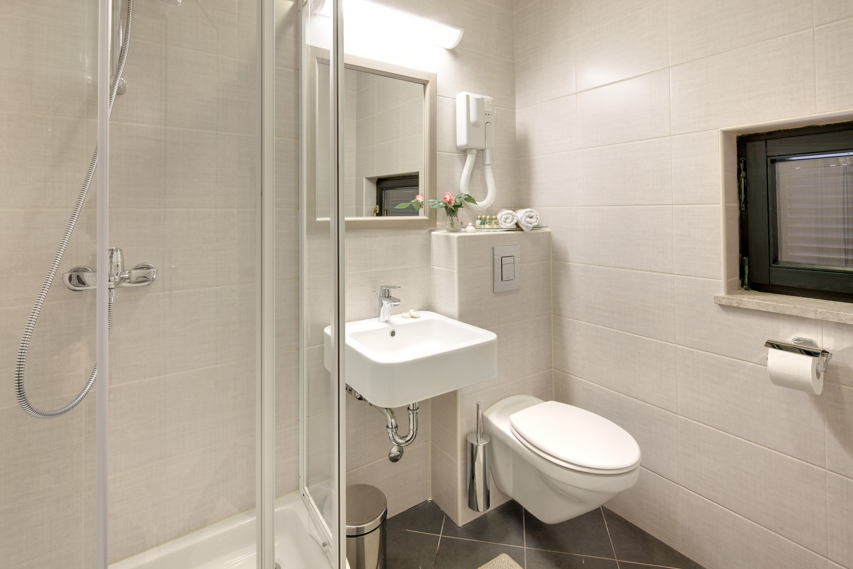 a bathroom with a shower and sink