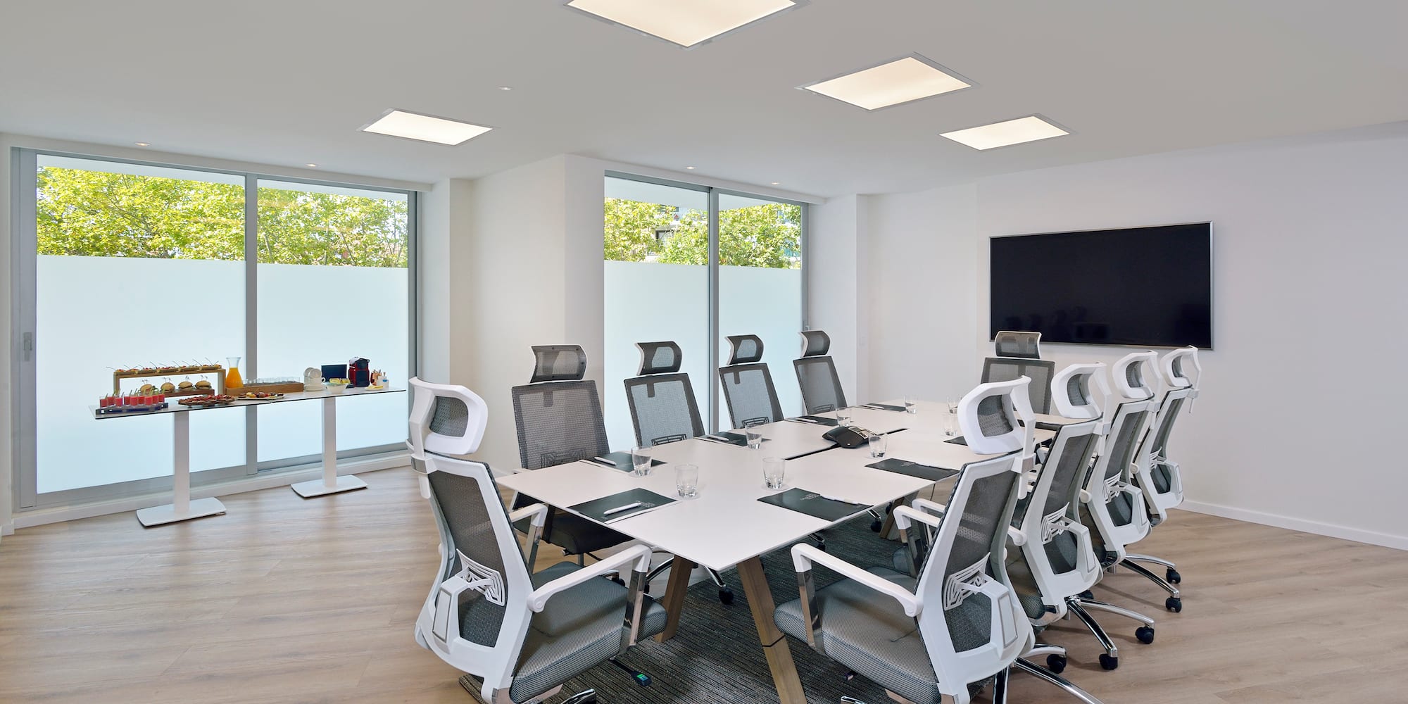 a conference room with a table and chairs