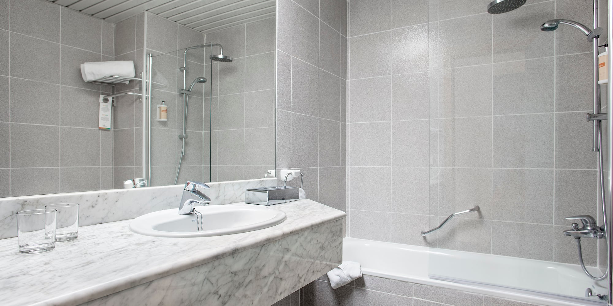 a bathroom with a shower and sink