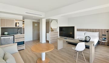 a room with a tv and a table