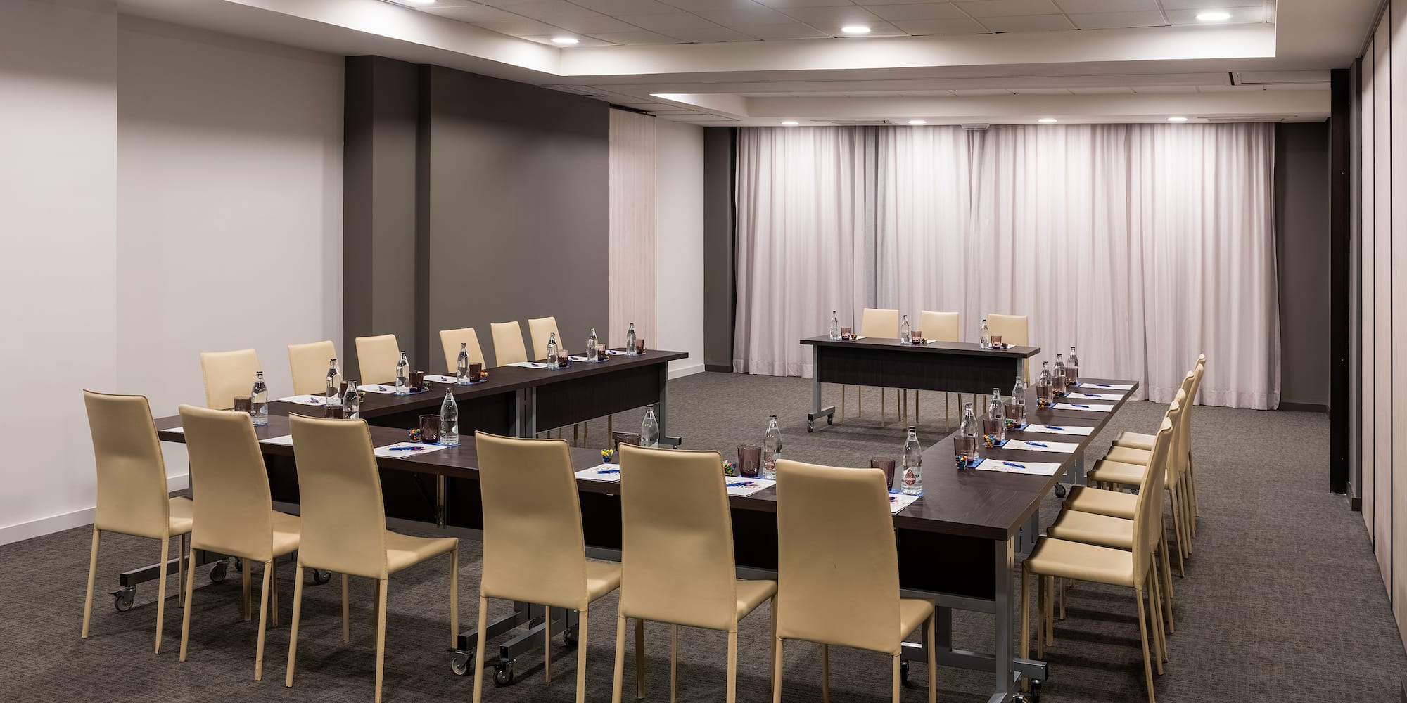 a room with tables and chairs