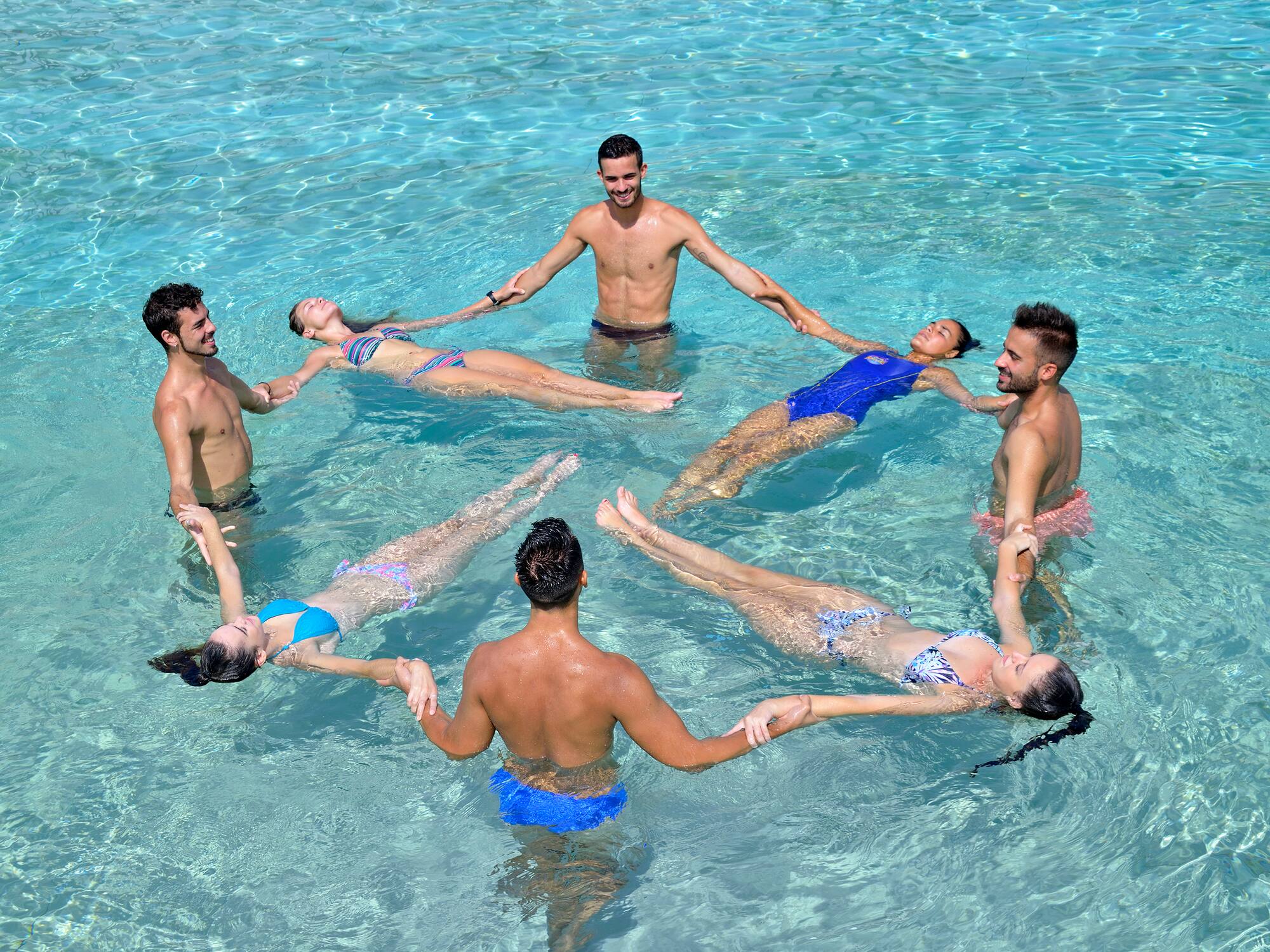 a group of people in a pool