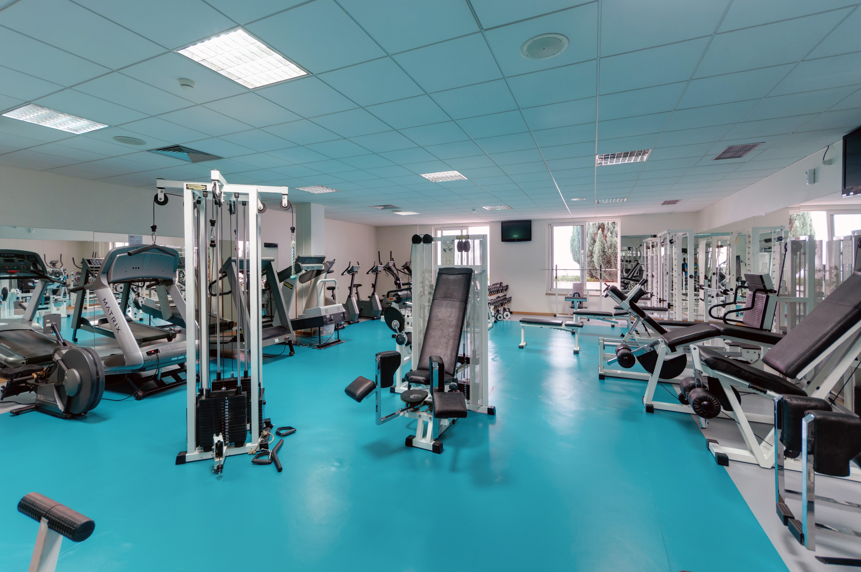 a large room with exercise equipment