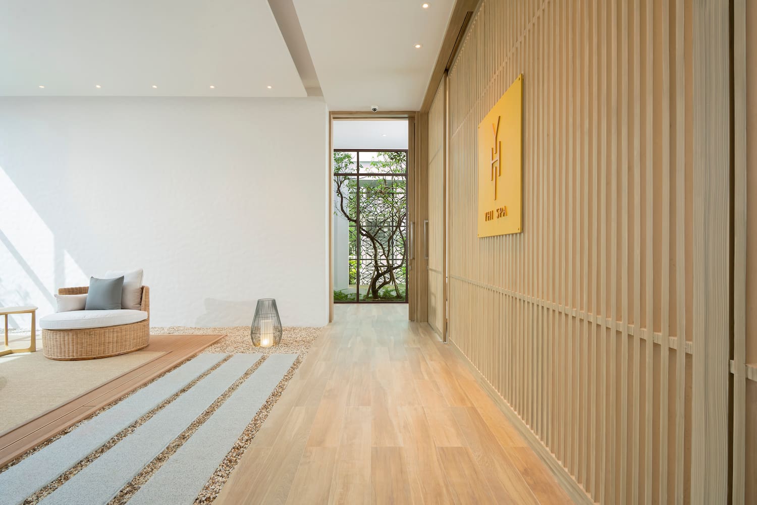 a room with a wood paneled wall and a couch