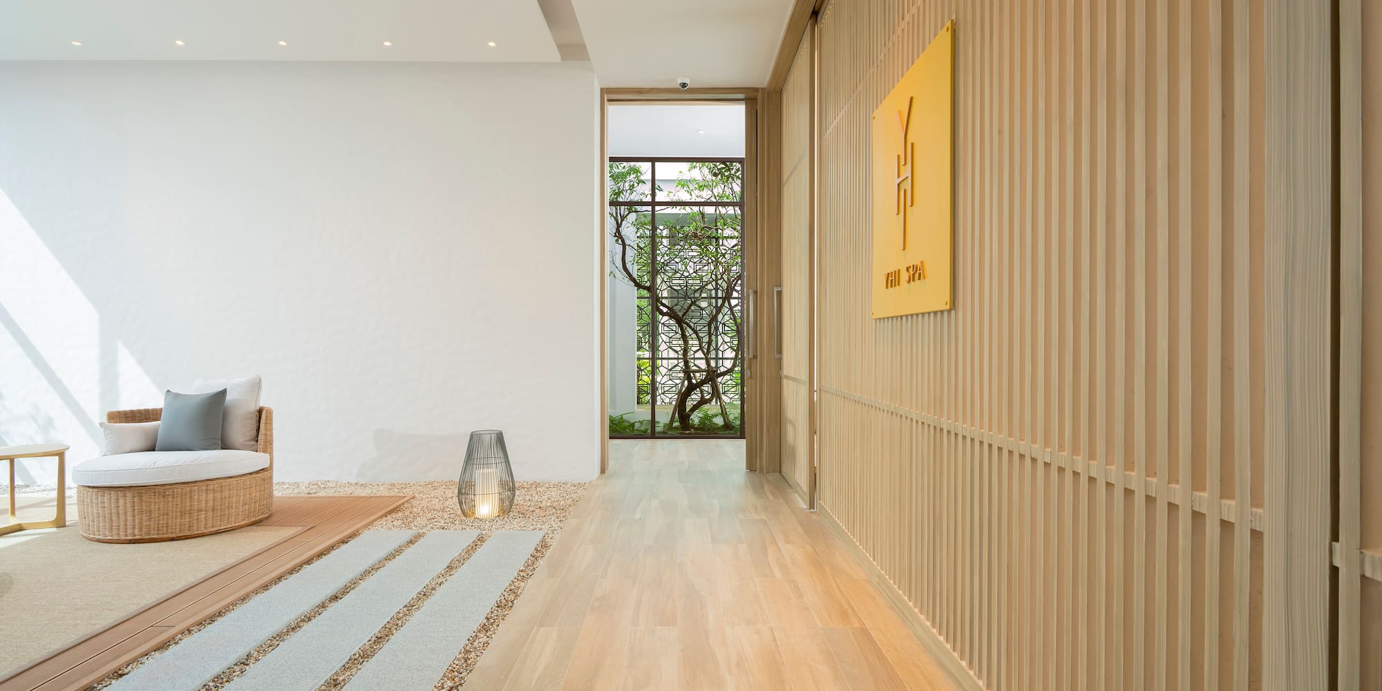 a room with a wood paneled wall and a couch