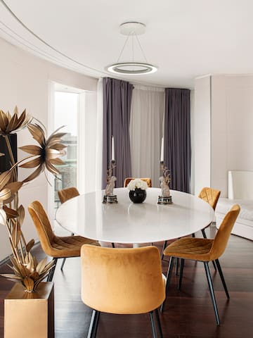 a dining table with chairs in a room