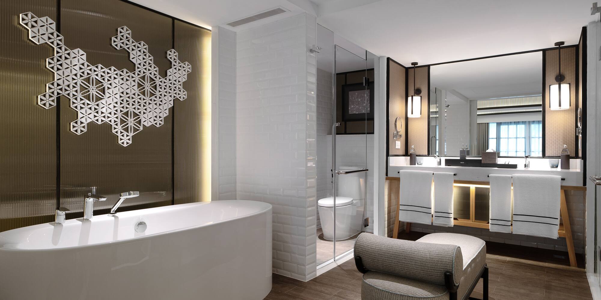 a bathroom with a tub and a mirror