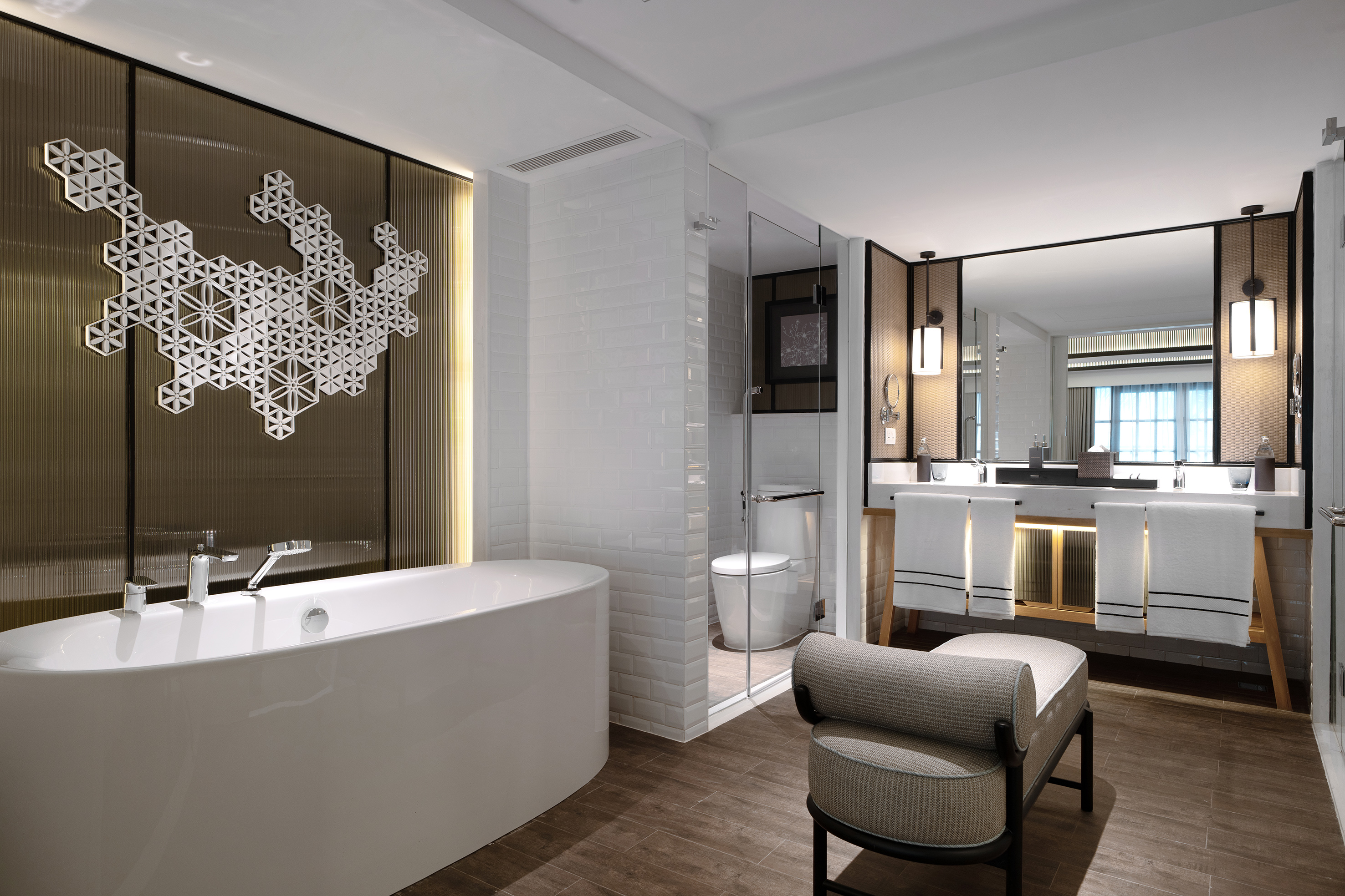 Modern luxury bathroom with freestanding tub, walk-in shower, and double vanity.