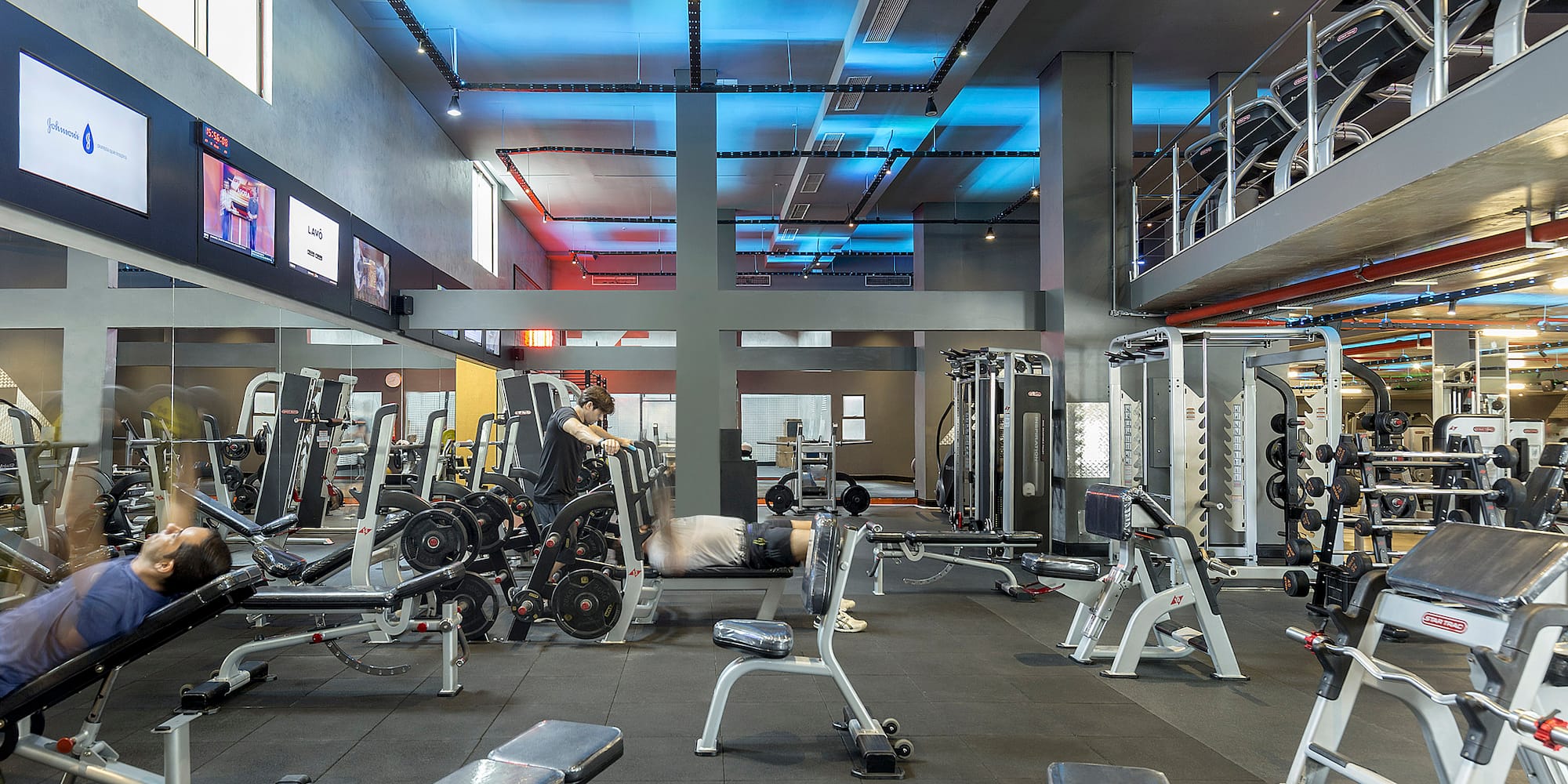 a gym with several equipment