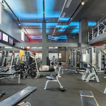 a gym with several equipment