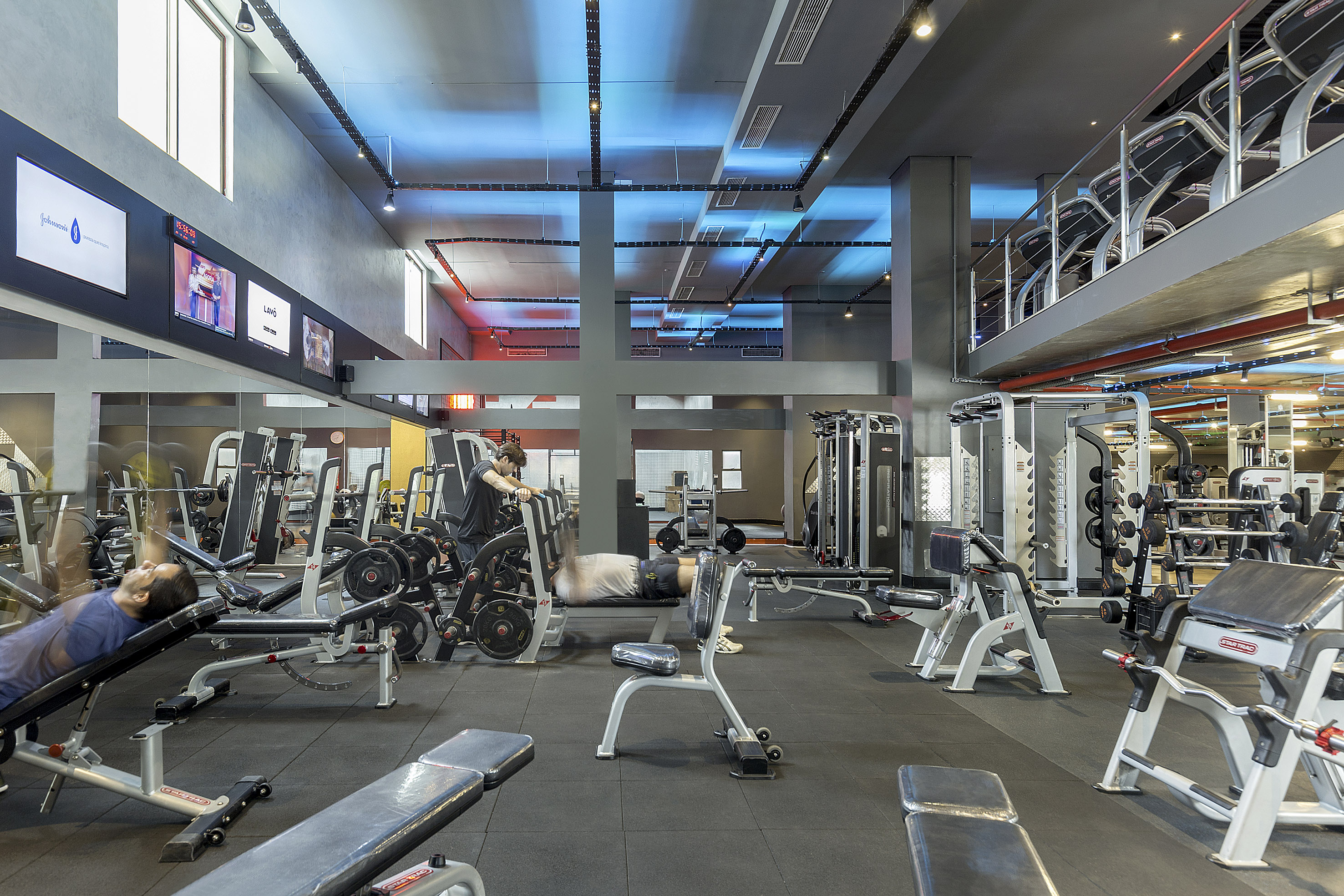 a gym with several equipment