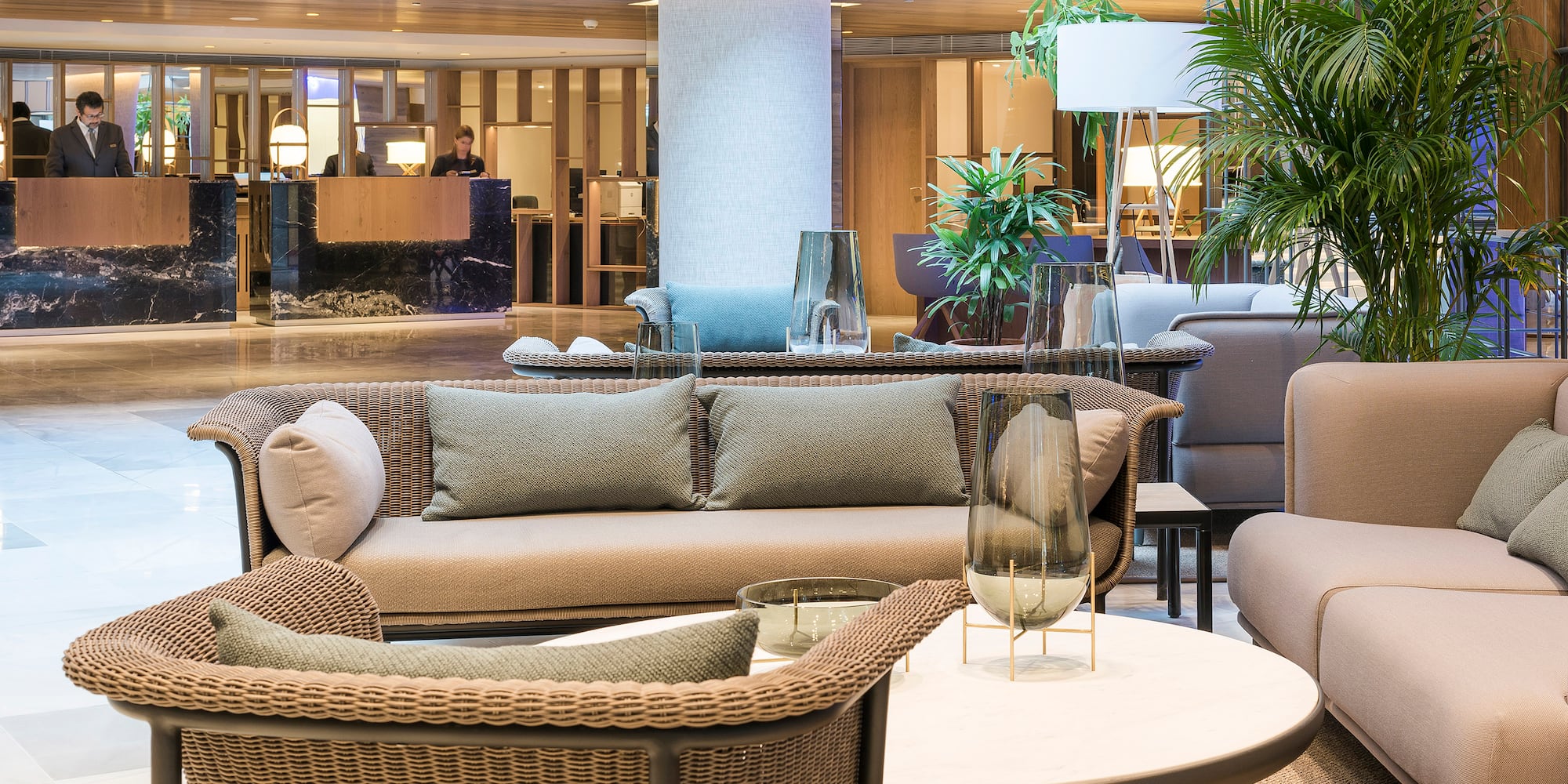 a lobby with a couch and chairs