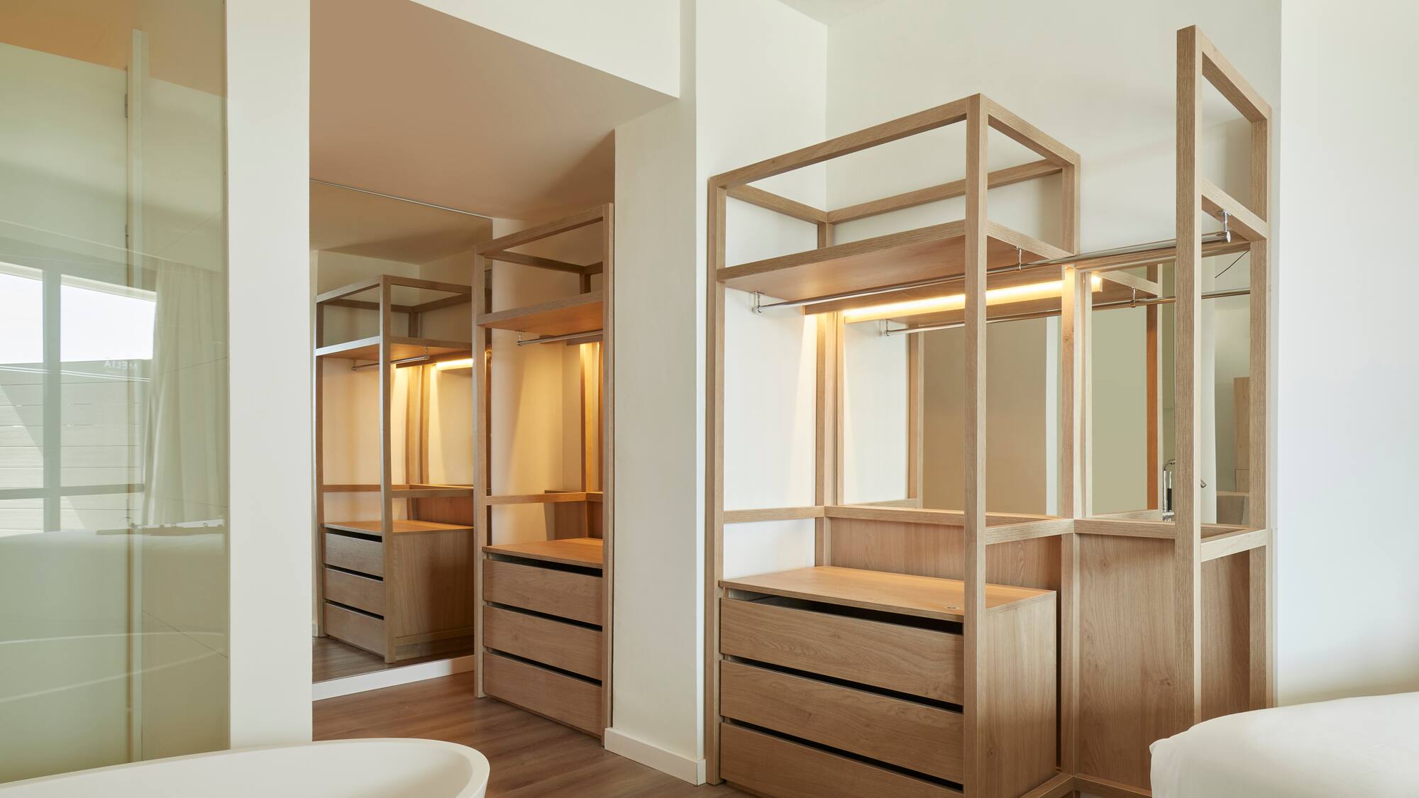 a bathroom with a tub and a mirror