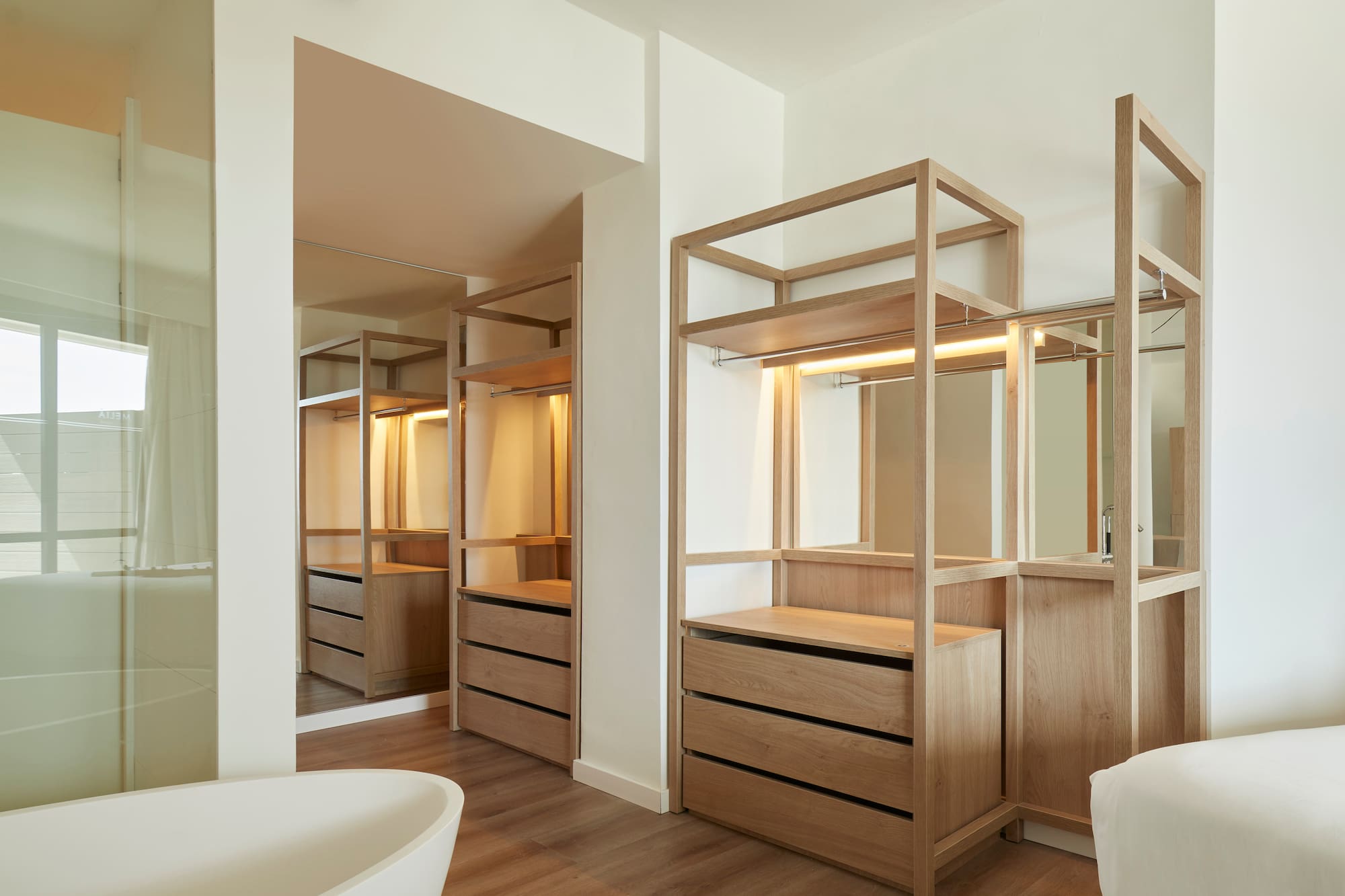 a bathroom with a tub and a mirror